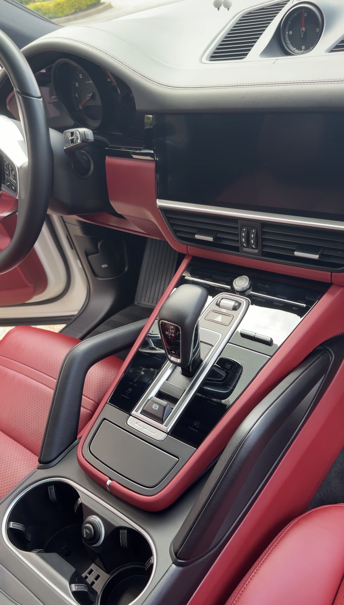 Porsche Cayenne center console after detailing, clean cup holders