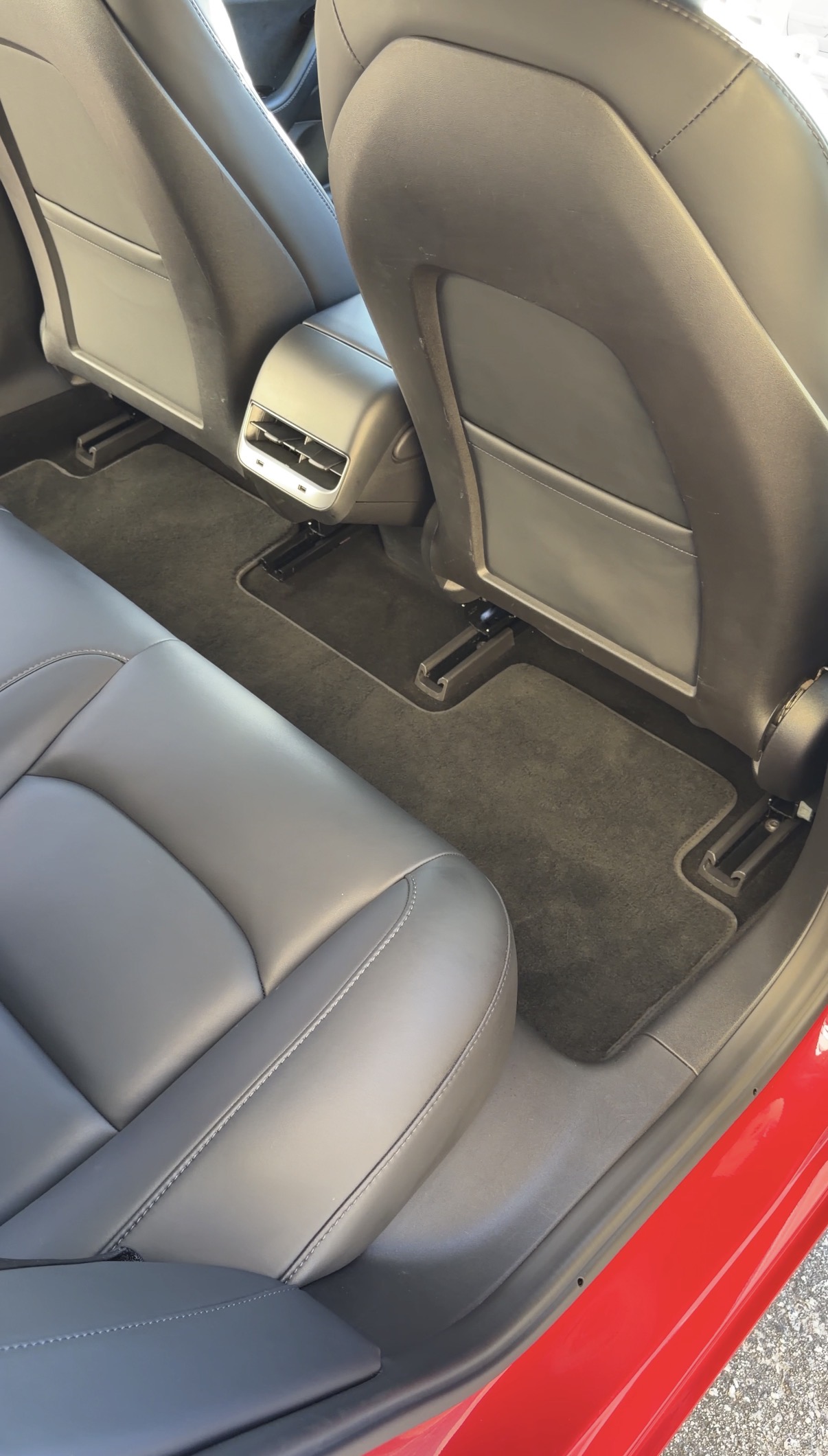 Tesla Model 3 rear seat floor after detailing, clean