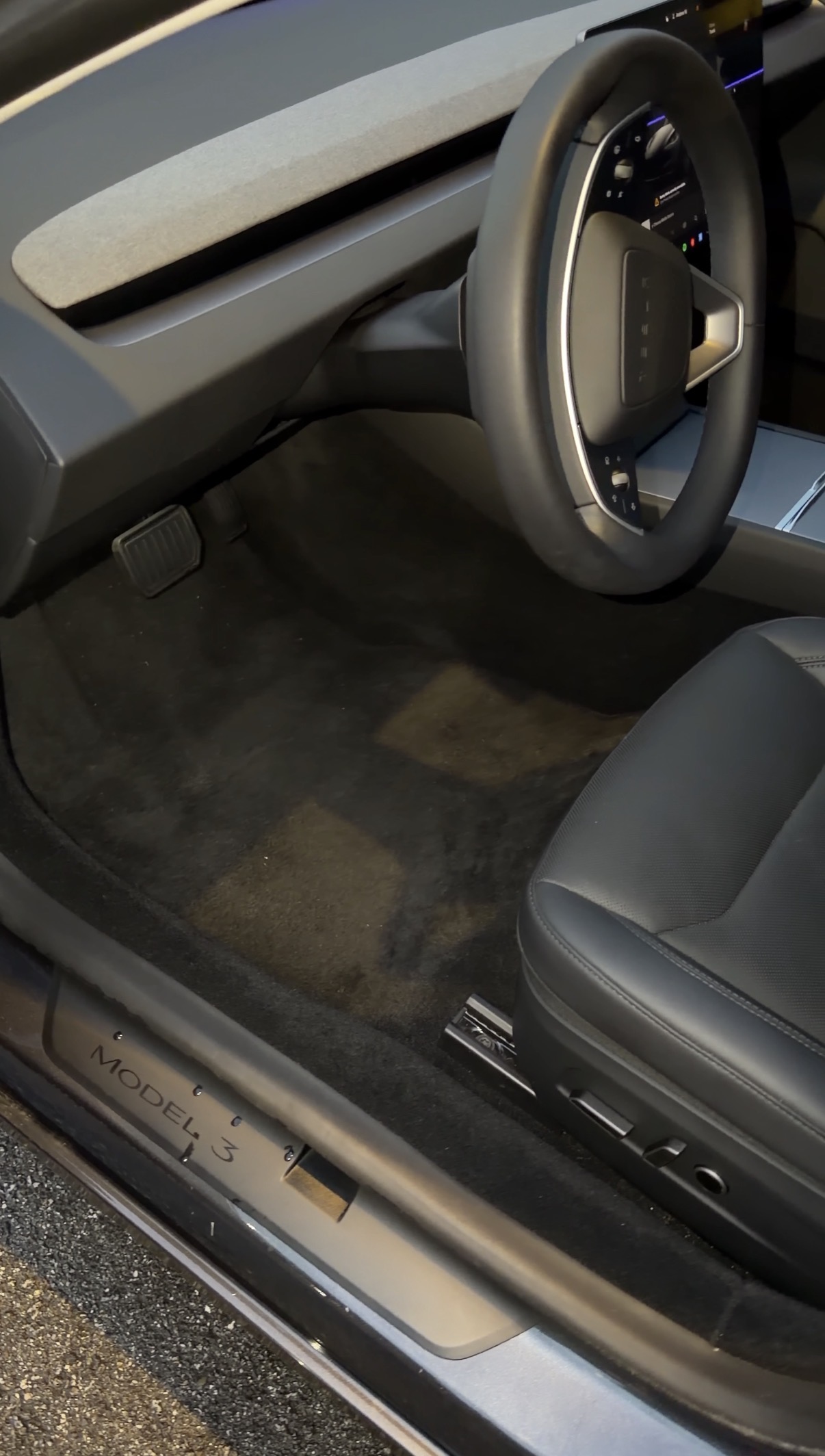 Clean detailed Tesla Model 3 driver footwell after mobile detailing in Western Addition
