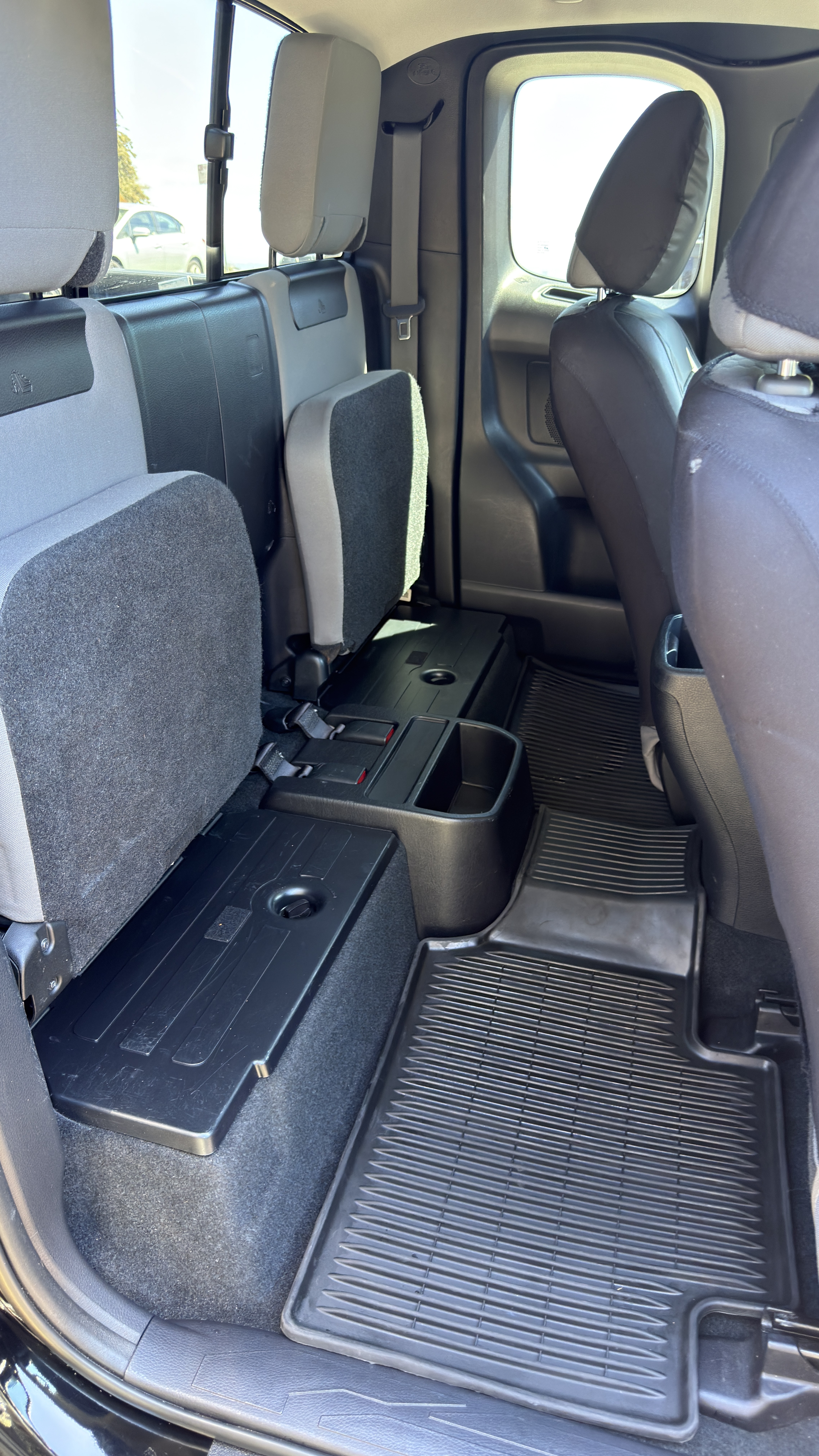 Toyota Tacoma extended cab rear seat after detailing, clean floor mats
