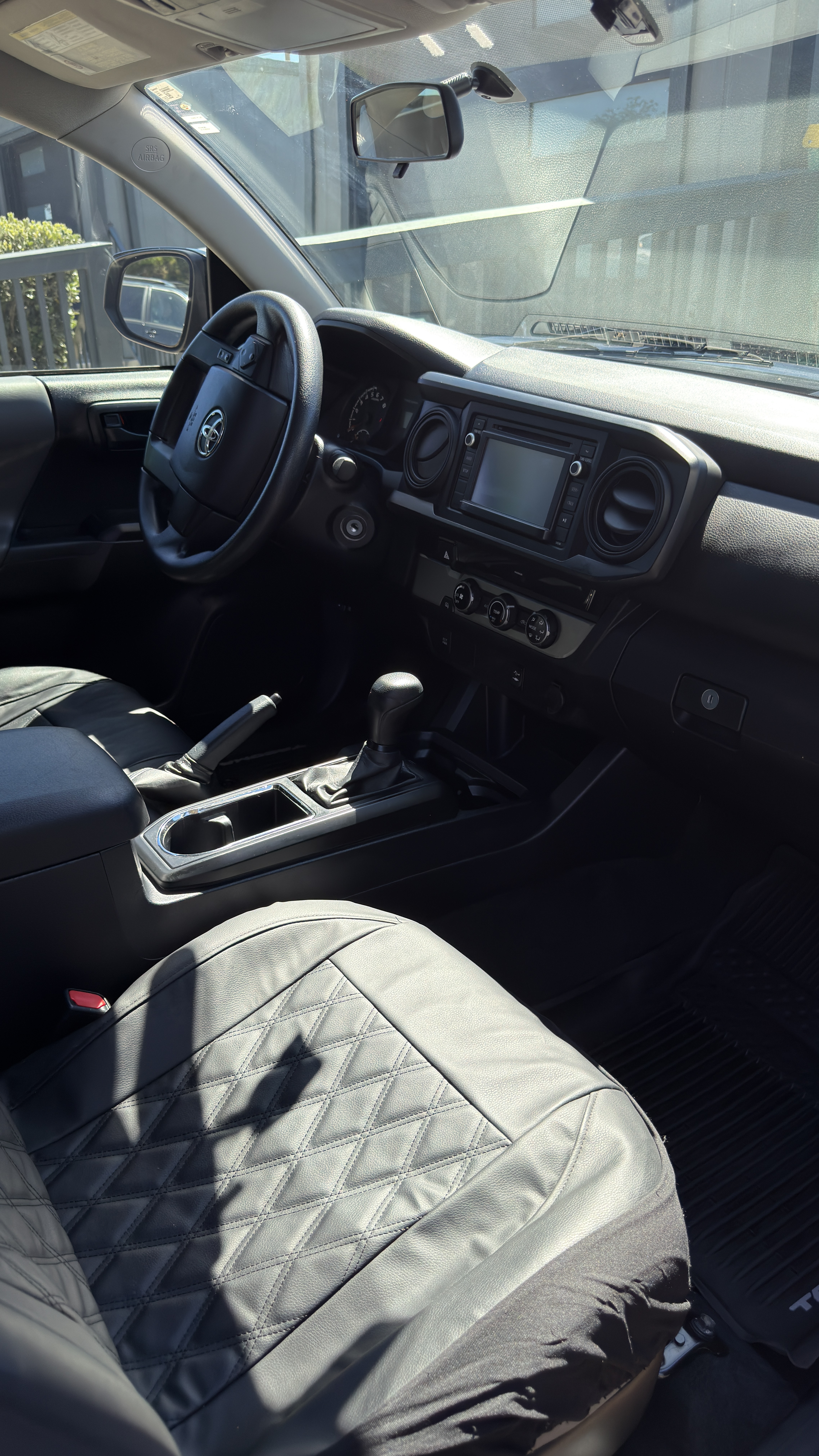 Toyota Tacoma driver cockpit after detailing, clean floor and dash