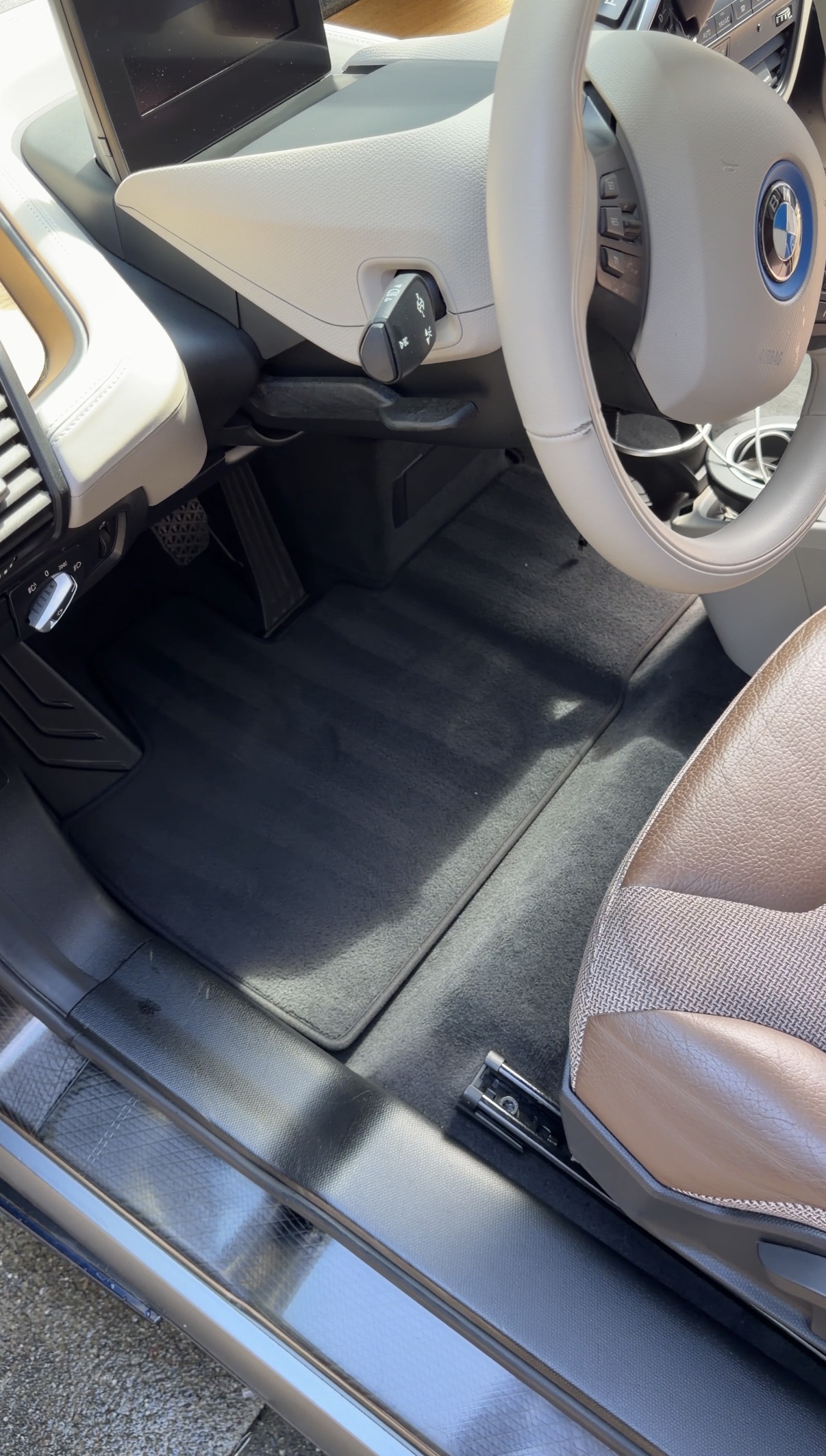 BMW i3 rear seat bench after detailing, clean two-tone leather and fabric