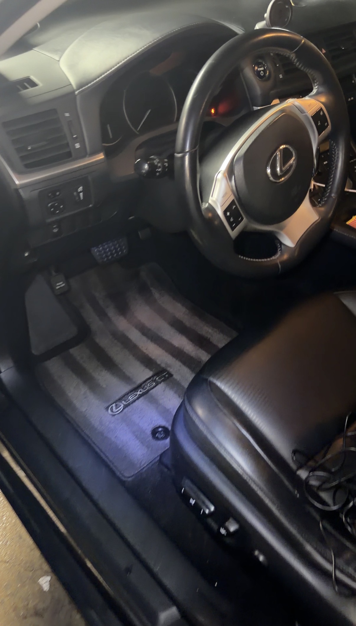Driver footwell after detail, mat restored and carpet clean