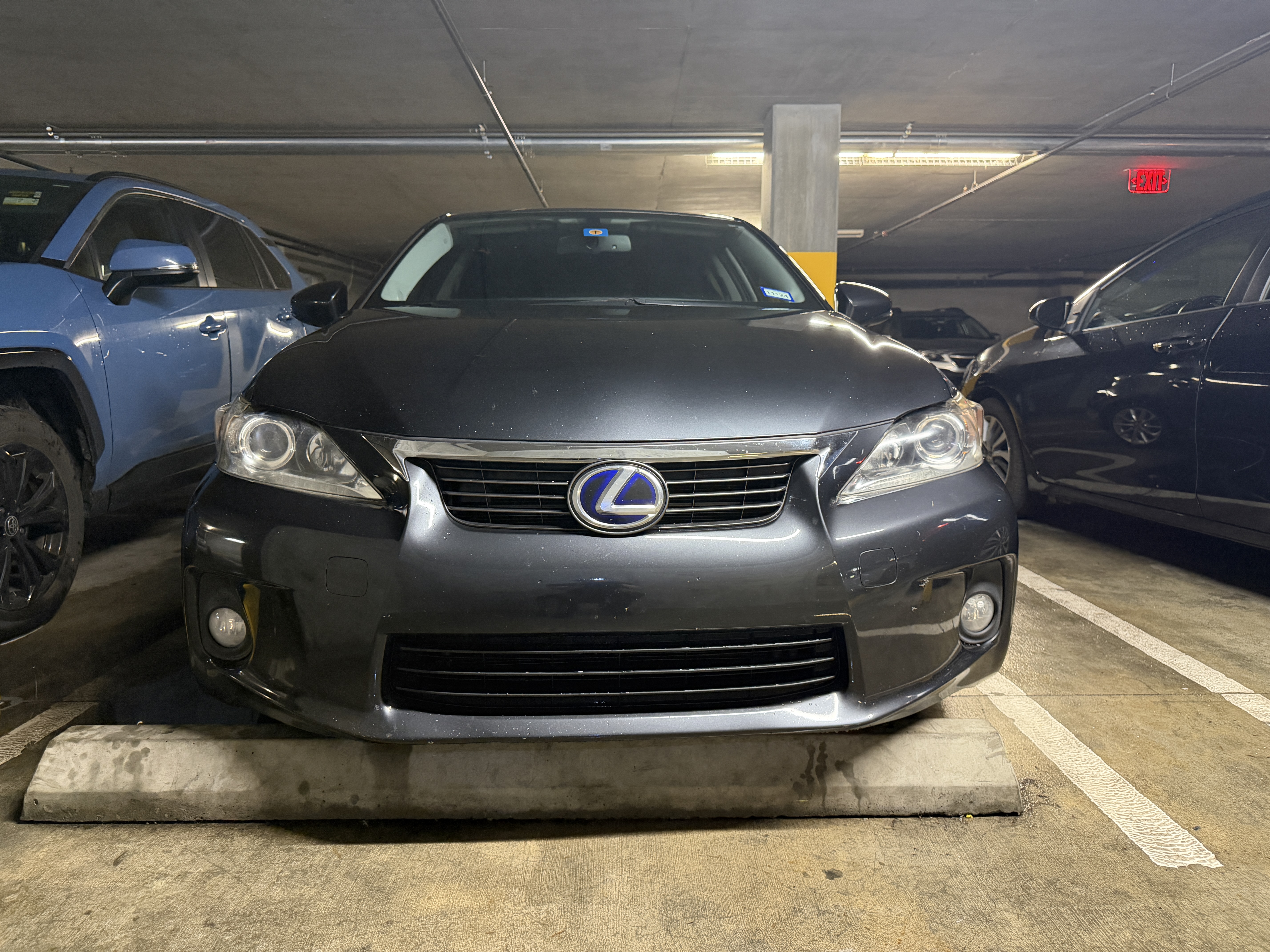 Same Lexus CT200h after mobile detail, headlights clear and paint cleaned