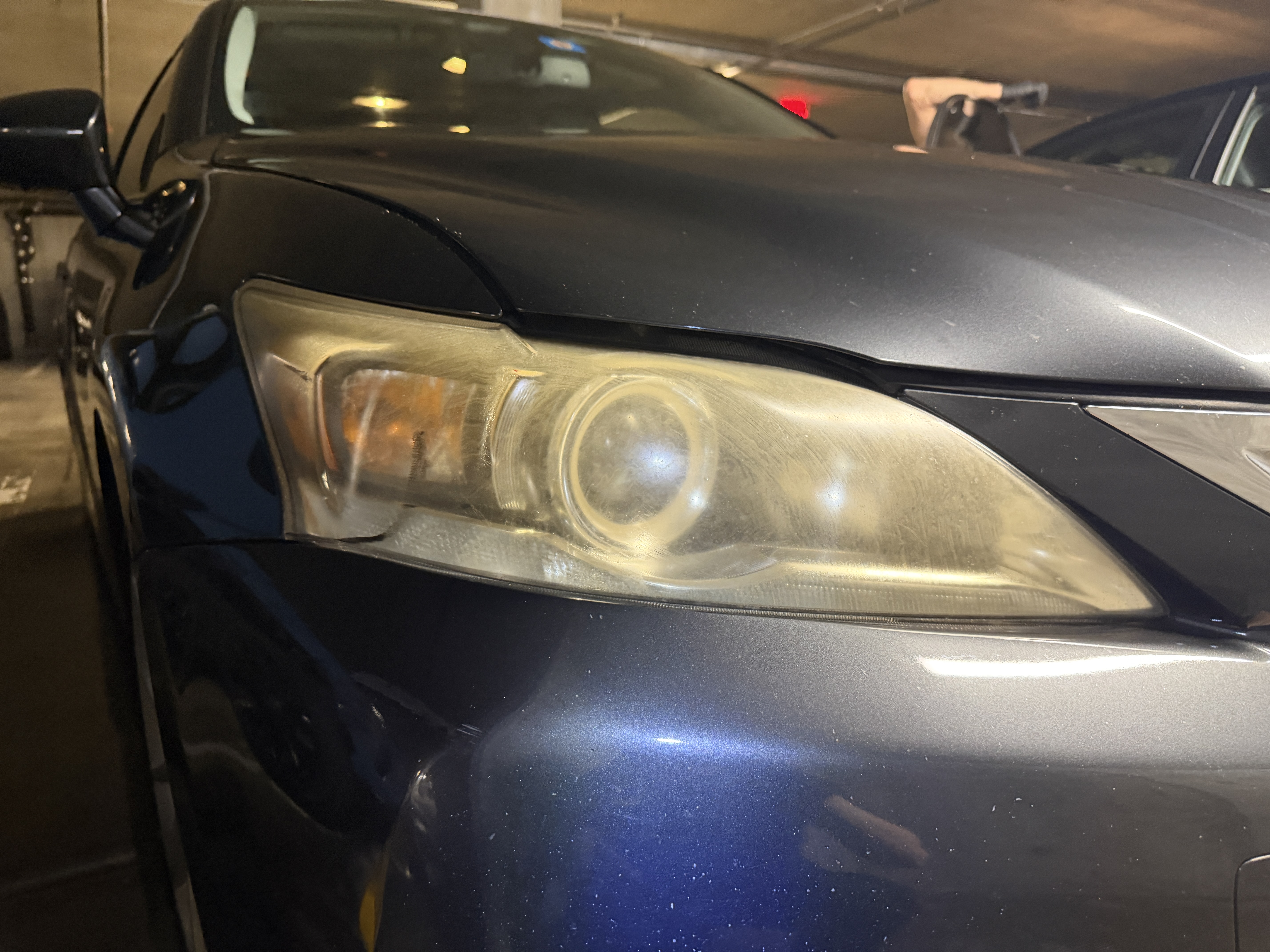 Hazy, oxidized headlight lens before restoration