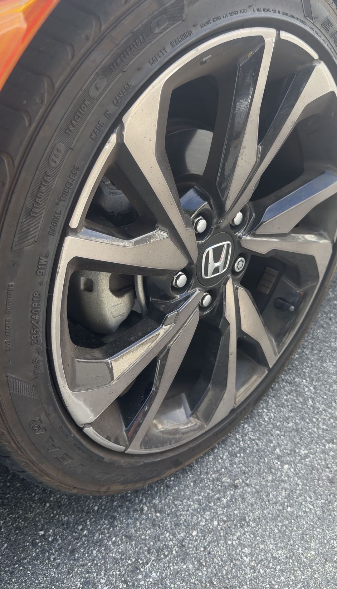 Brake dust on the 18-inch alloy wheel of a Honda Civic Sport before cleaning