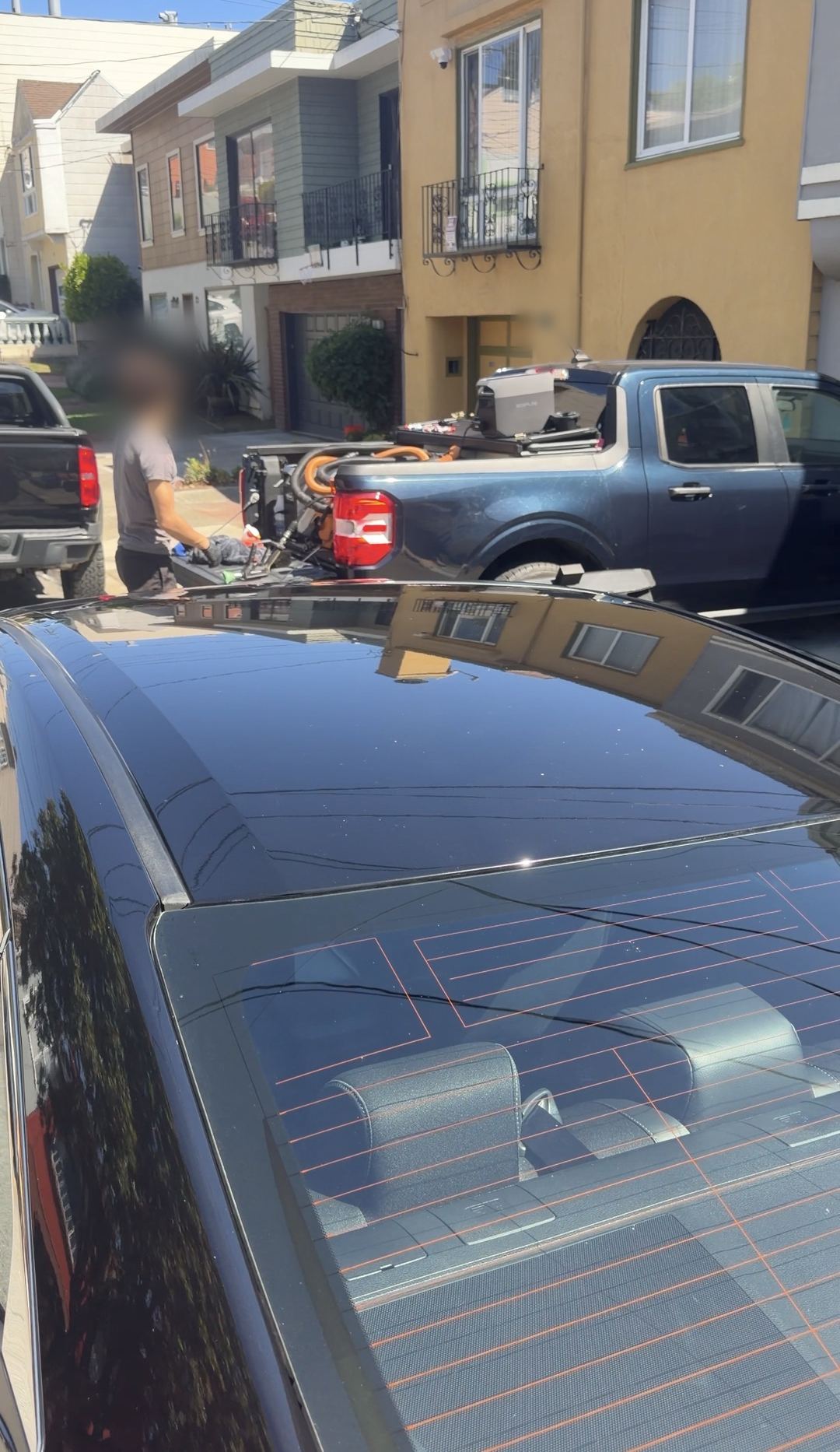 Glossy roof of a detailed Honda Civic with the SF City Wash mobile rig behind it