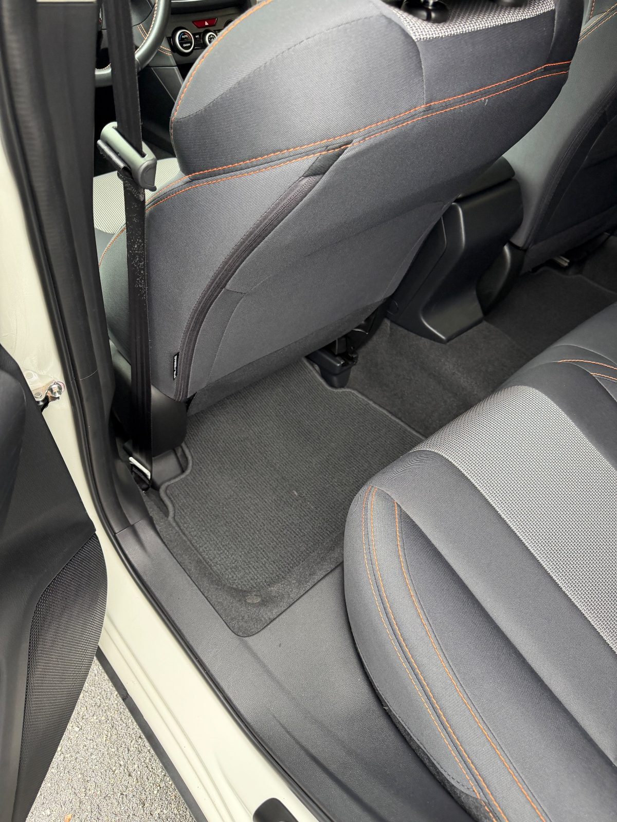 Clean rear footwell mat of a Subaru Crosstrek after vacuuming