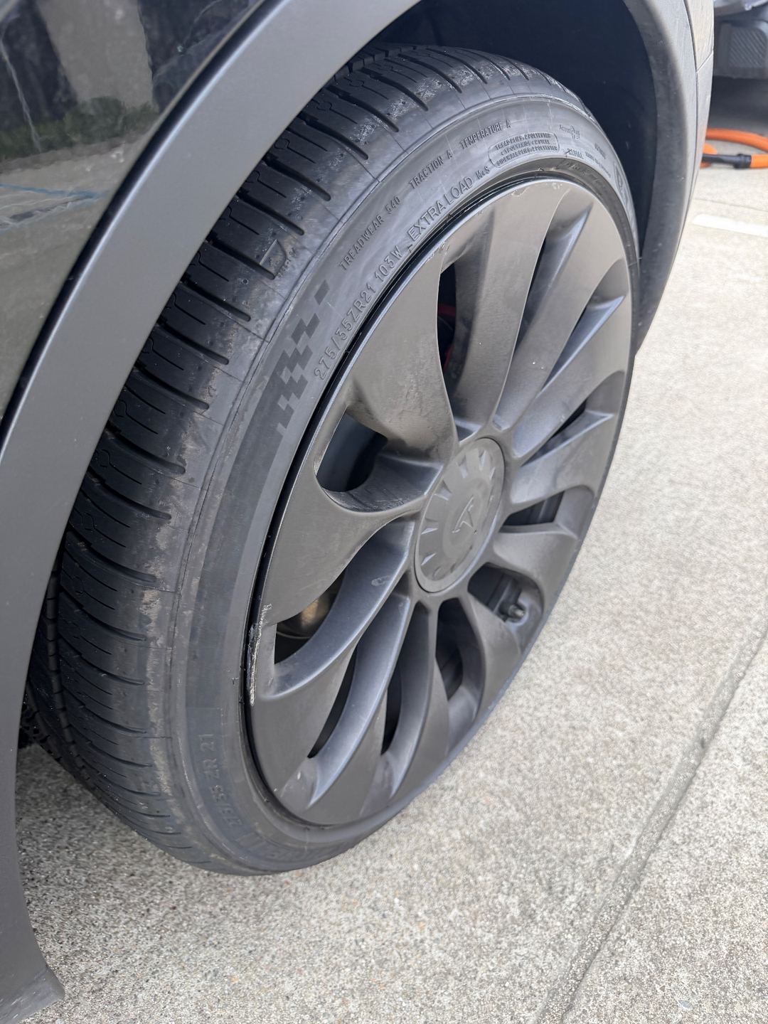 Wheel and tyre of a Tesla Model Y Performance before cleaning, with brake dust on the spokes