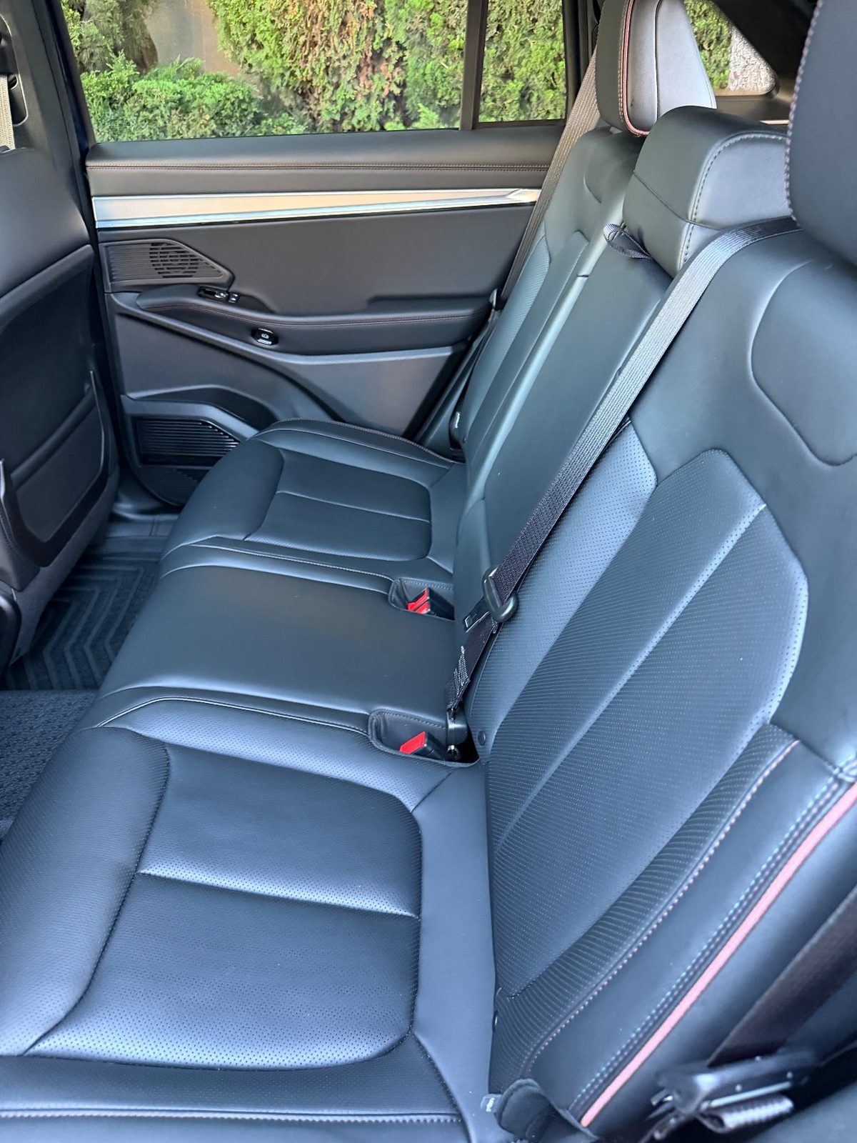 Clean rear leather seat of a Jeep Wagoneer S after detailing