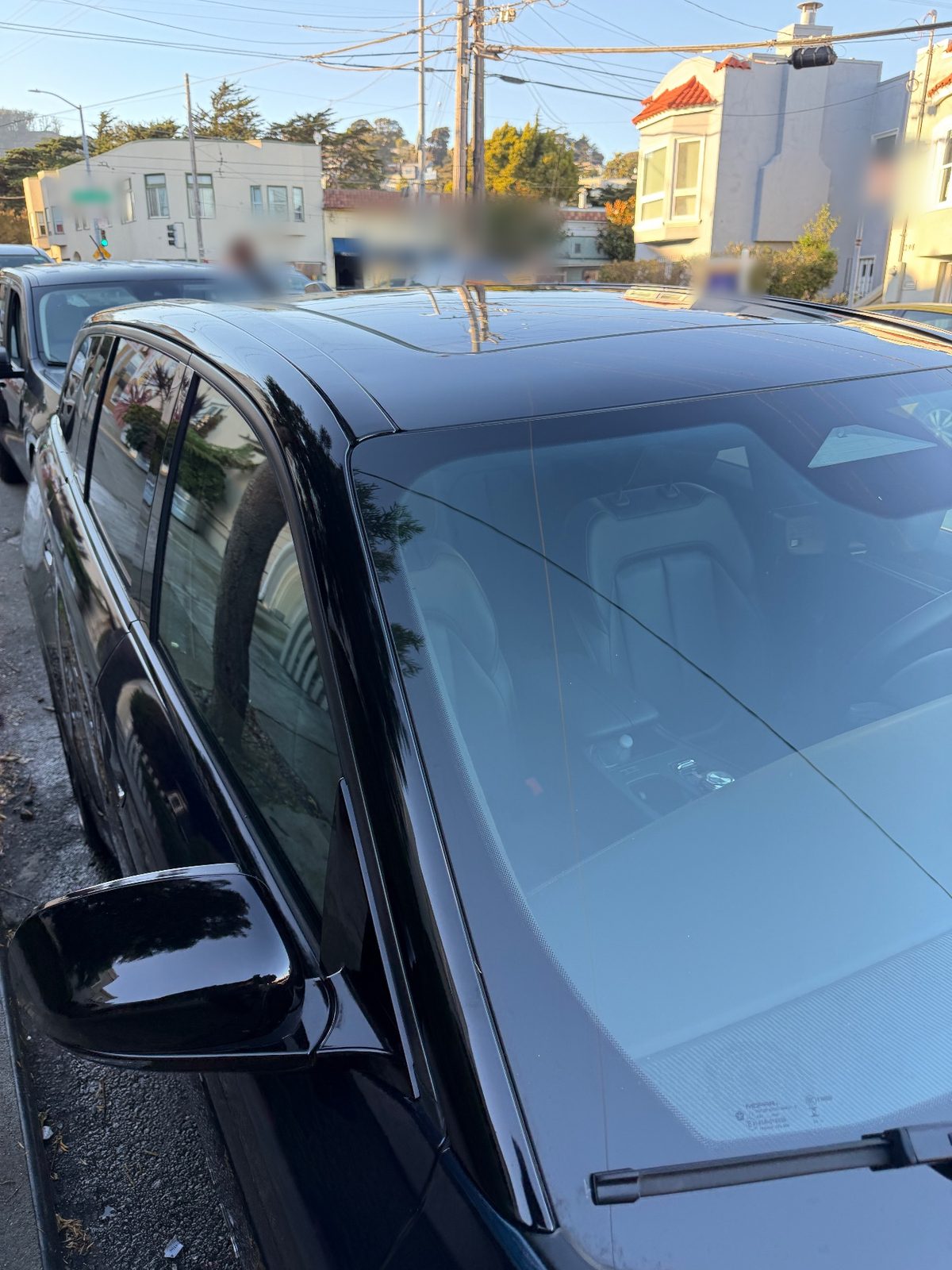 Clean windscreen and roof of a Jeep Wagoneer S after detailing