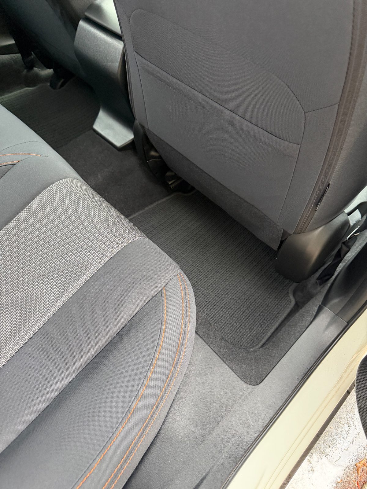 Clean rear footwell and seat-back of a Subaru Crosstrek after vacuuming