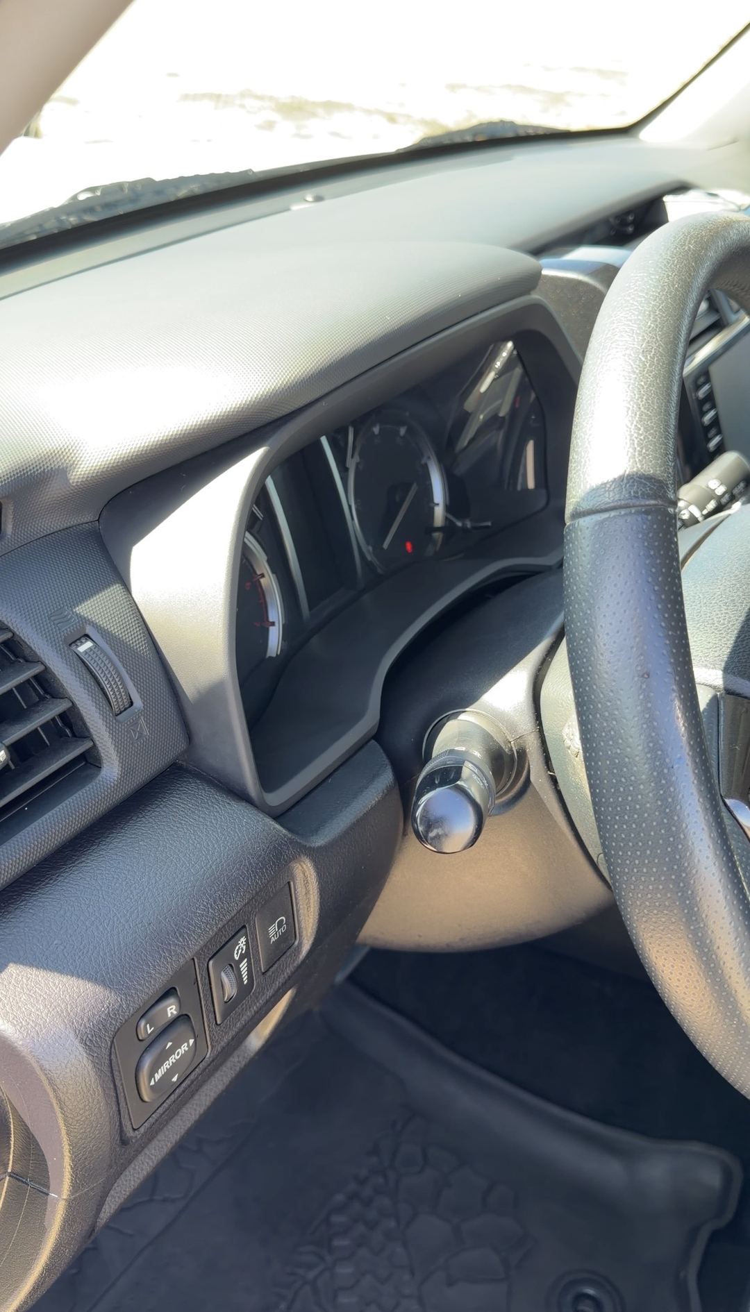 Clean dashboard, gauge hood and steering wheel of a Toyota 4Runner