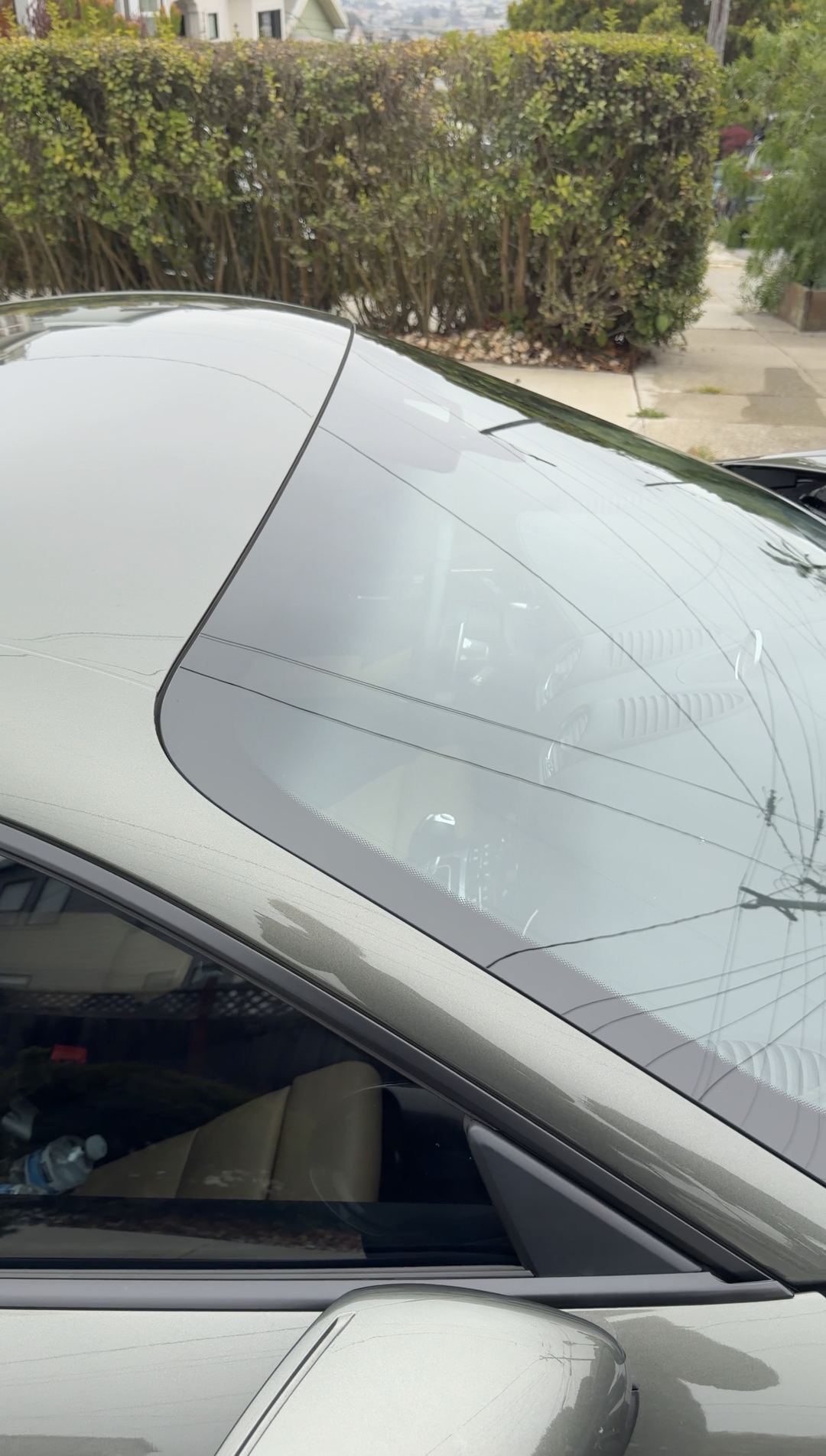 Clean windscreen and A-pillar of a Porsche 718 Cayman S after a mobile detail.