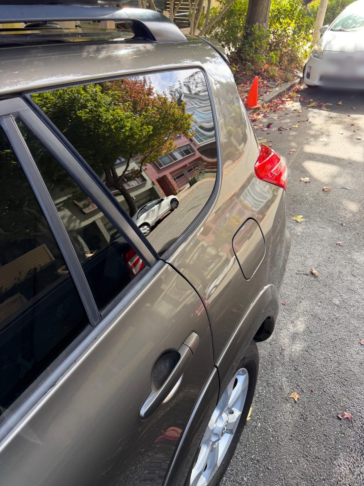 Clean rear door and quarter of a 2011 Toyota RAV4 after washing