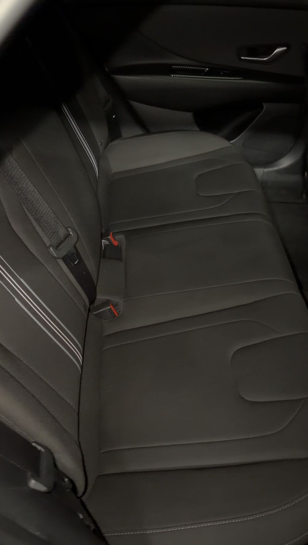 Clean black cloth rear bench seat in a Hyundai Elantra after detailing