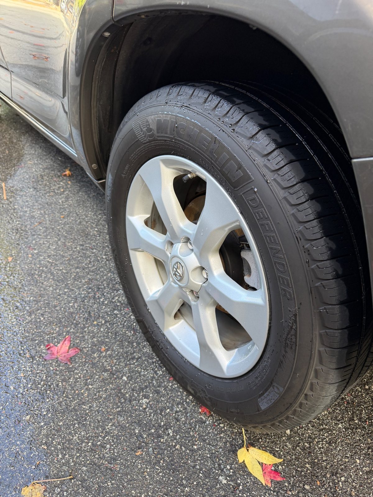 Clean alloy wheel and dressed tyre on a 2011 Toyota RAV4 after cleaning