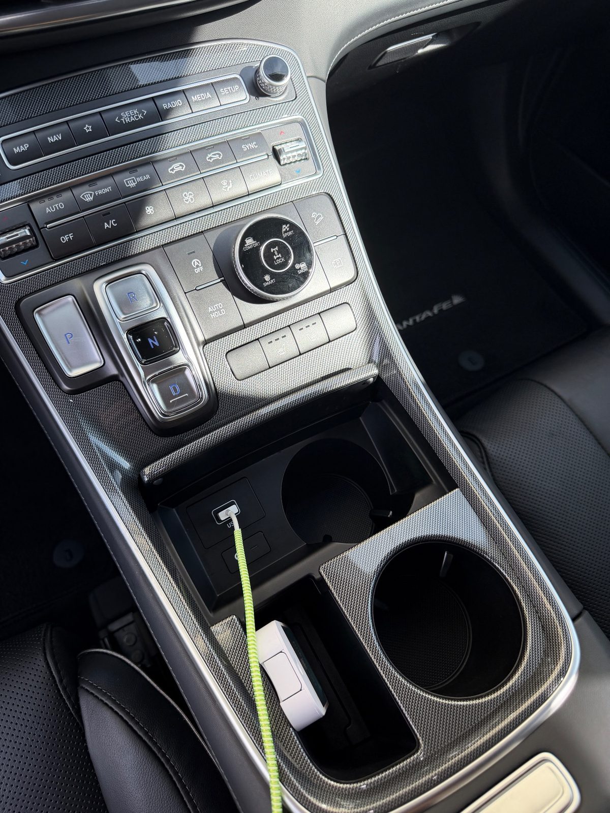 Clean cupholders and centre console of a Hyundai Santa Fe after detailing