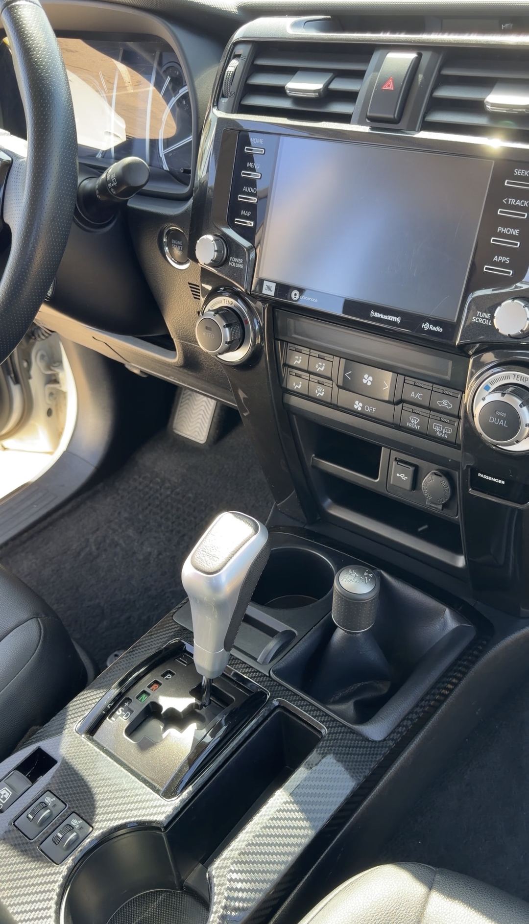 Clean center stack, touchscreen and console with carbon-pattern trim in a Toyota 4Runner