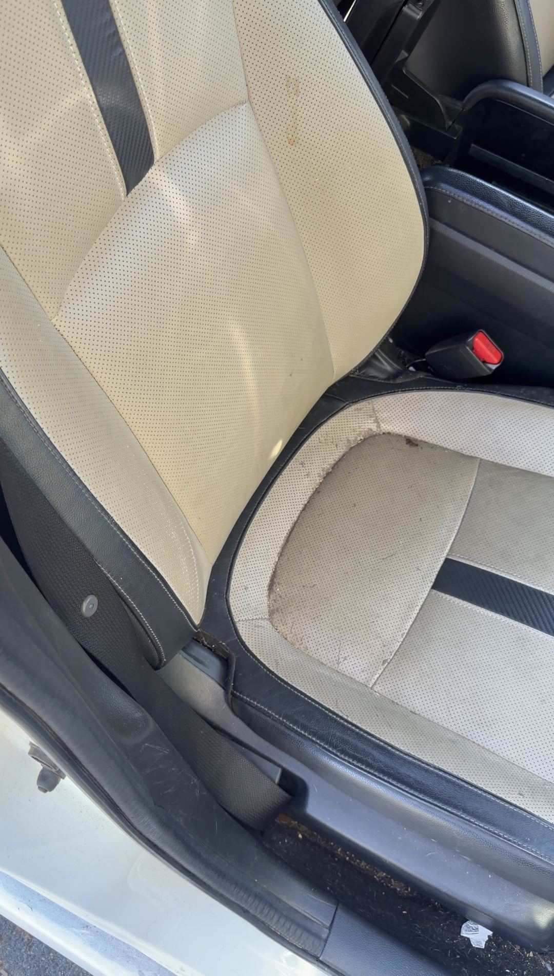 Front passenger seat of a Honda Civic before cleaning, with soiling along the cushion seam