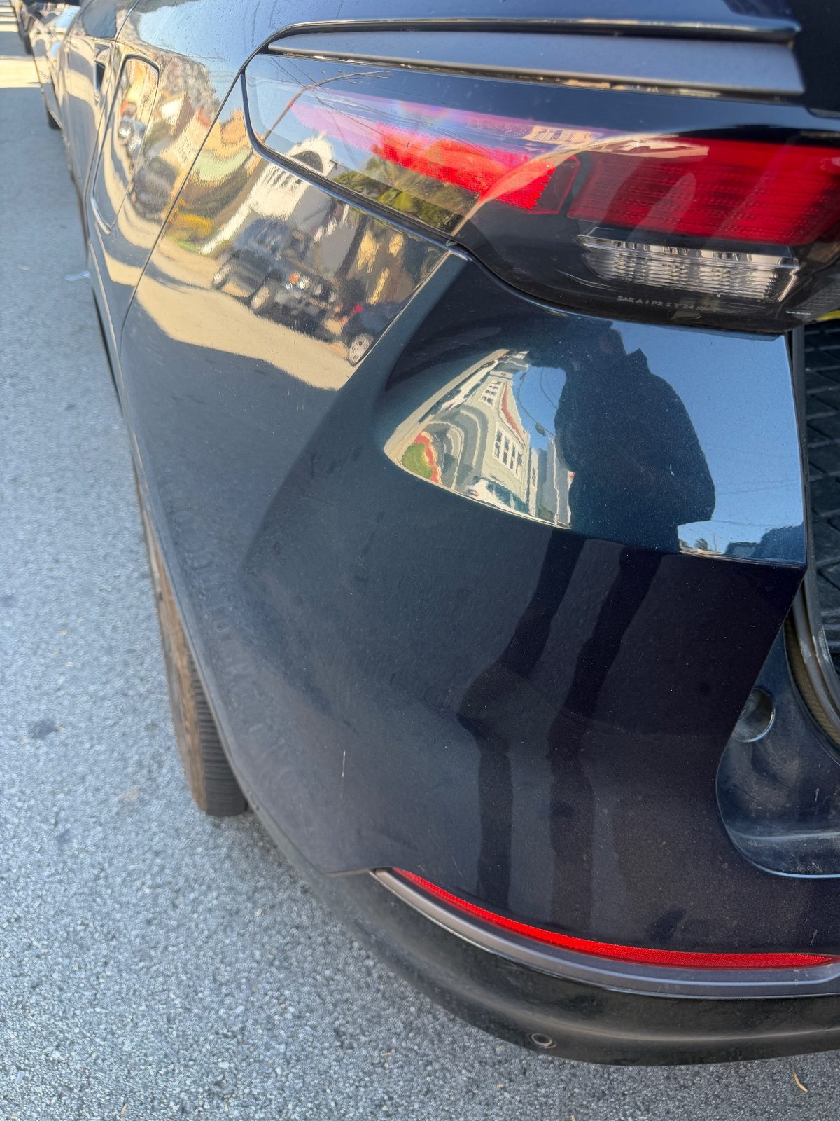 Rear bumper corner of a Jeep Wagoneer S before detailing