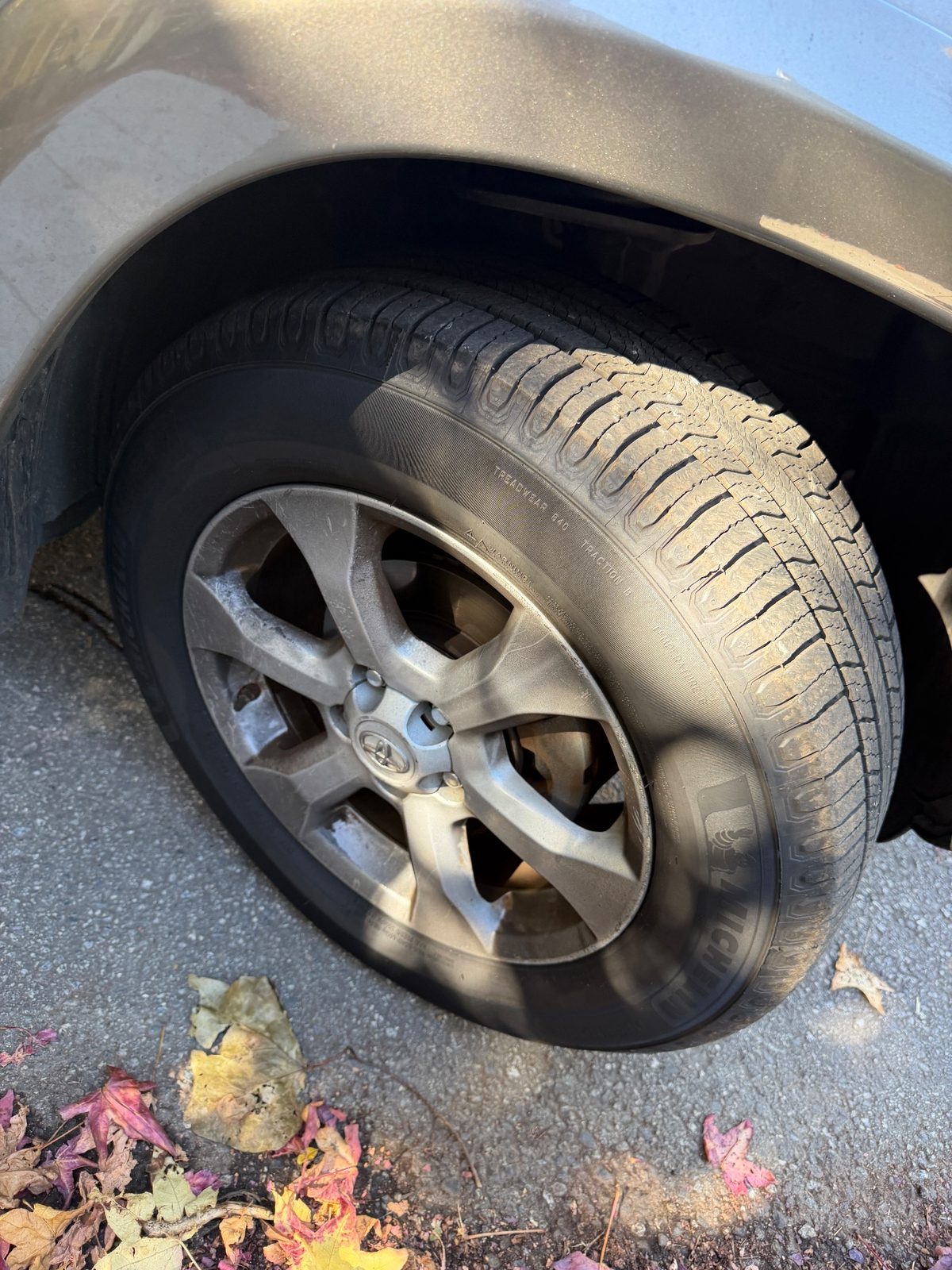 Dusty alloy wheel on a 2011 Toyota RAV4 before cleaning