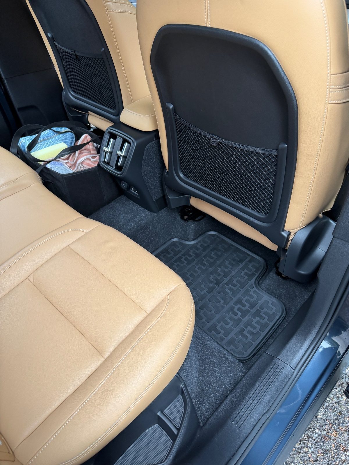 Clean rear passenger-side footwell of a Volvo XC40 after detailing