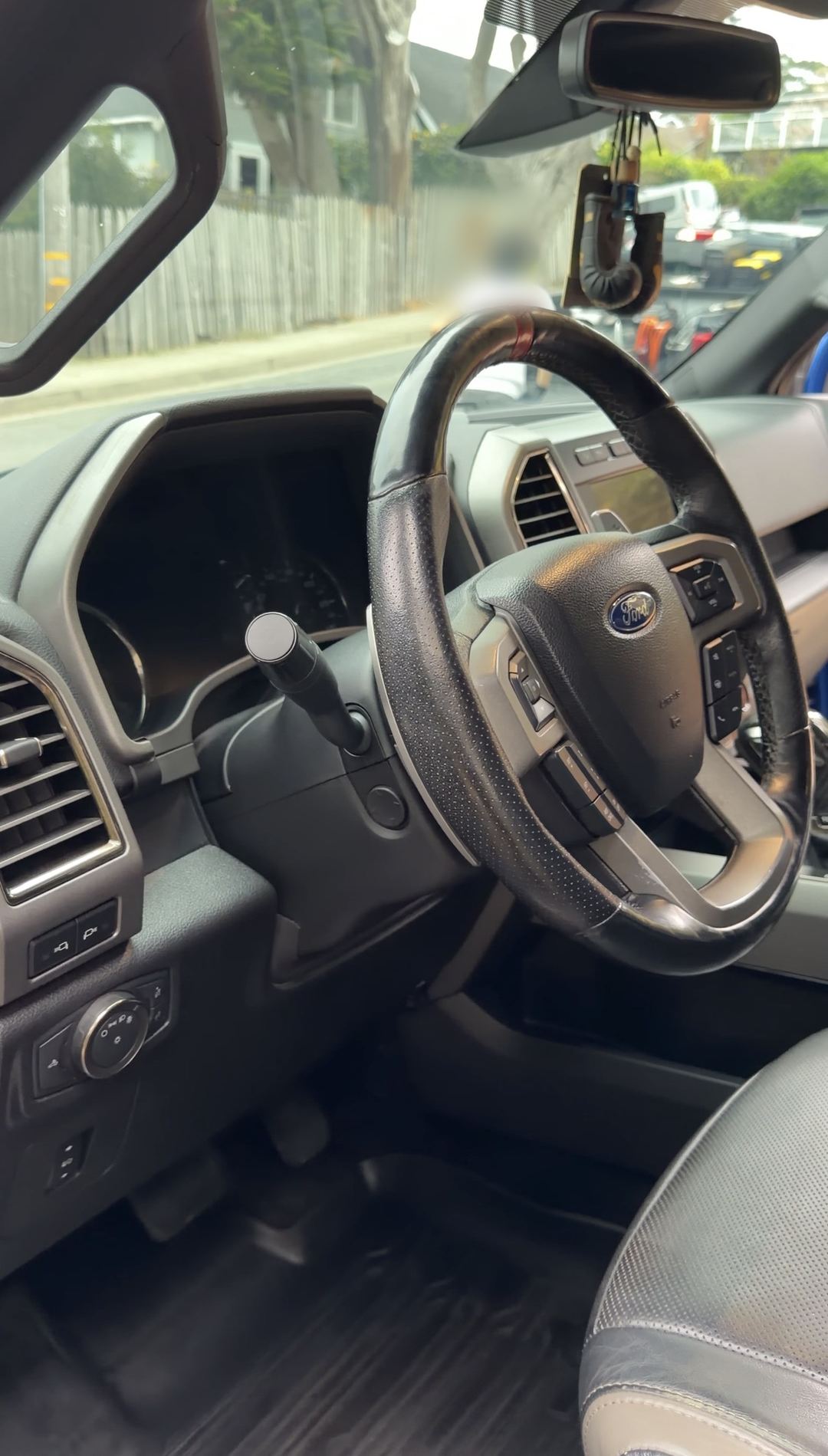 Clean dash and steering wheel of a Ford F-150 Raptor after an interior detail