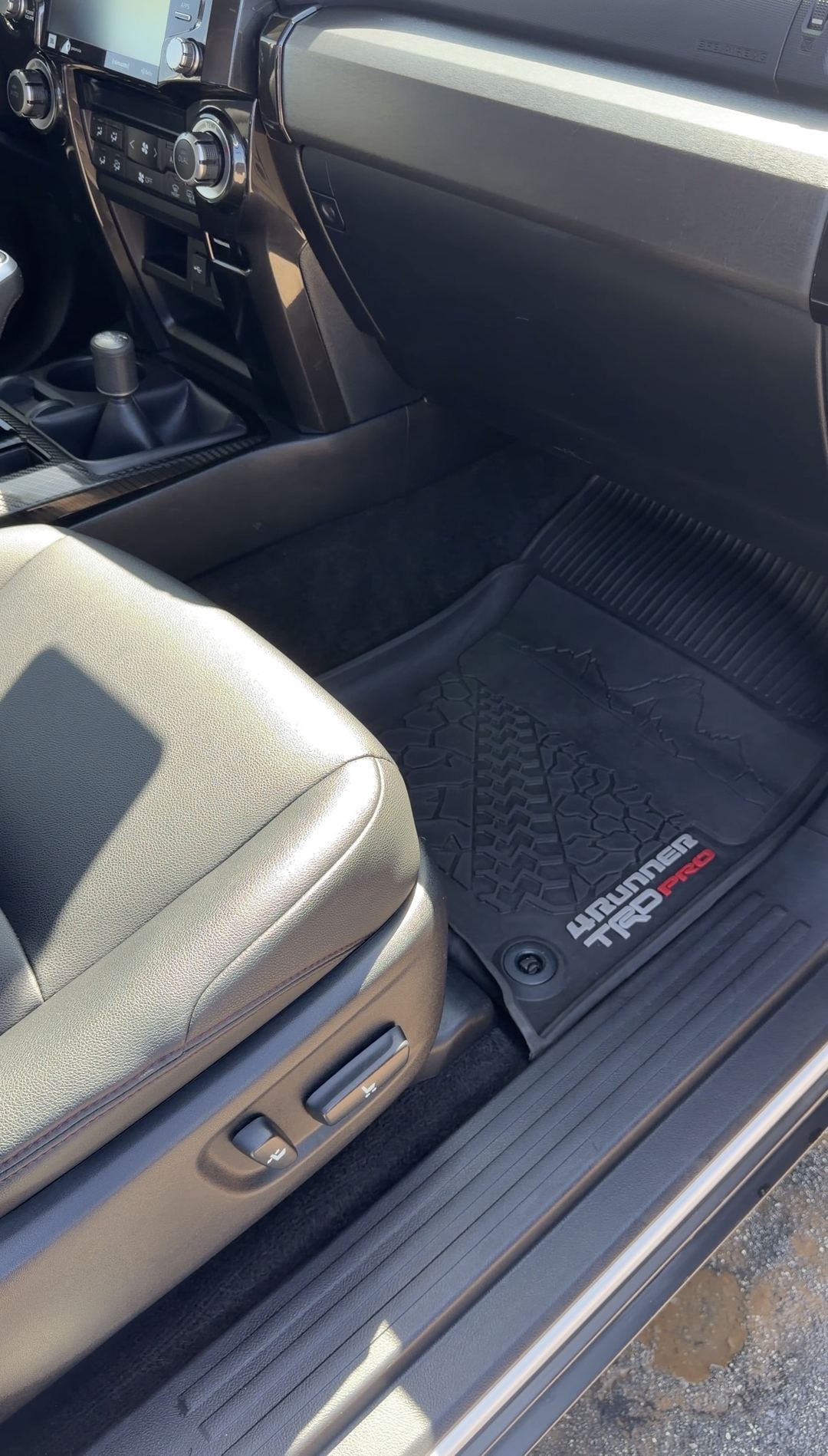 Clean 4Runner TRD Pro floor mat and door sill in a Toyota 4Runner front passenger footwell