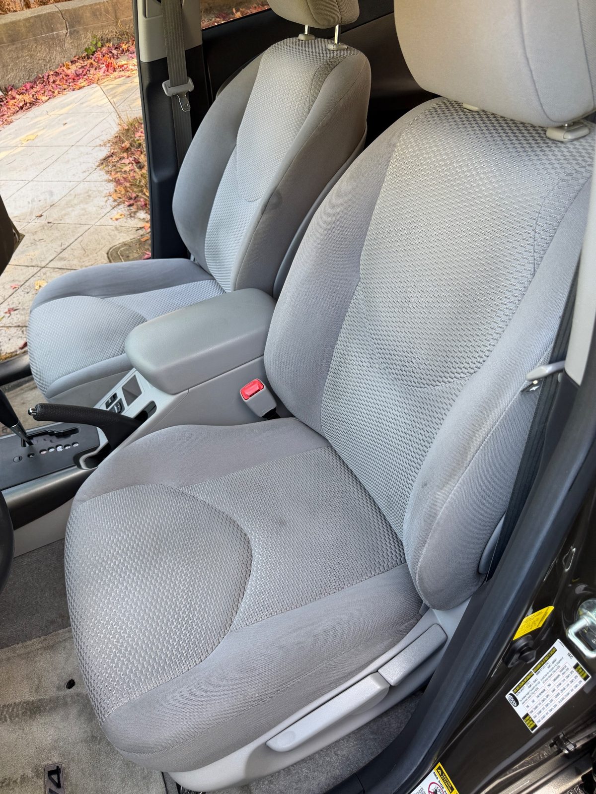 Clean front cloth seats of a 2011 Toyota RAV4 after detailing