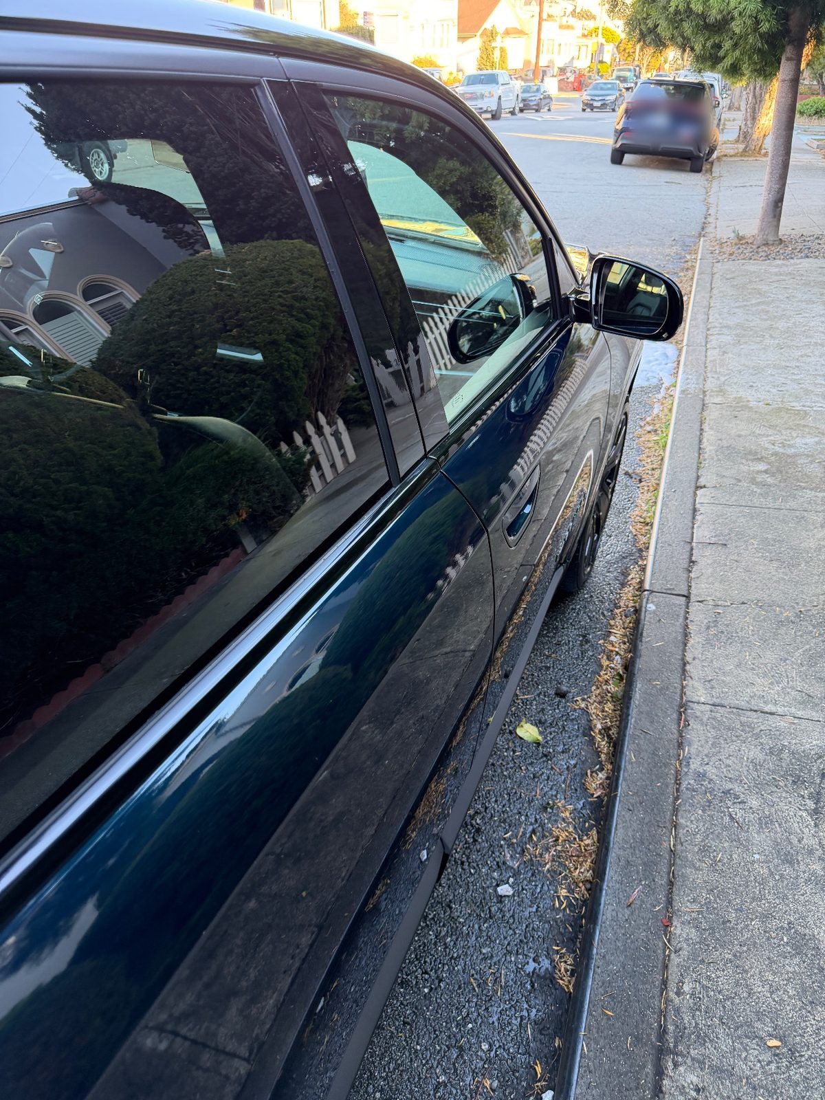 Glossy side panels of a Jeep Wagoneer S after detailing
