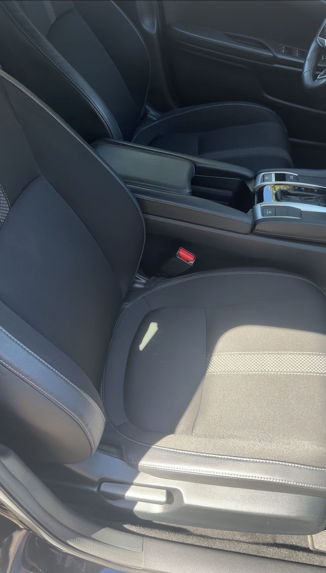 Stain-free cloth front seat of a Honda Civic after cleaning