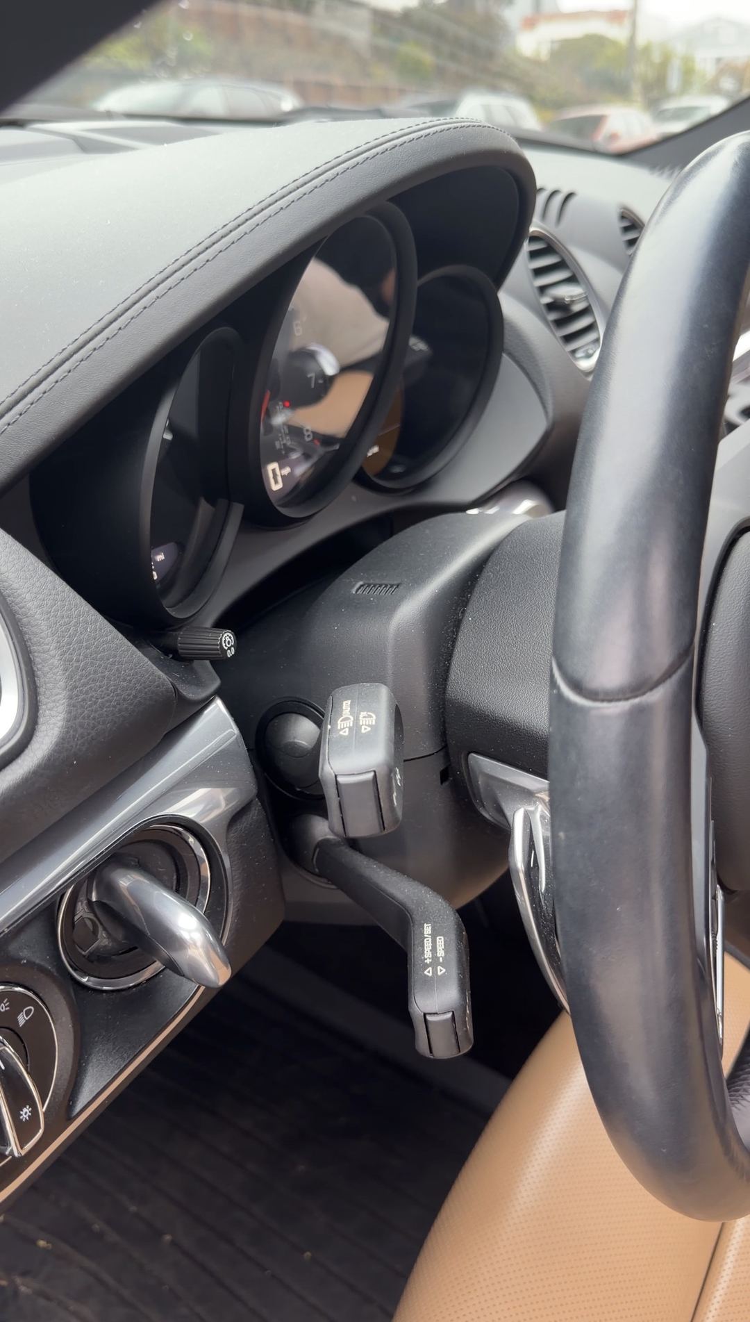 Dust-filmed instrument cluster and dash of a Porsche 718 Cayman S before an interior detail.