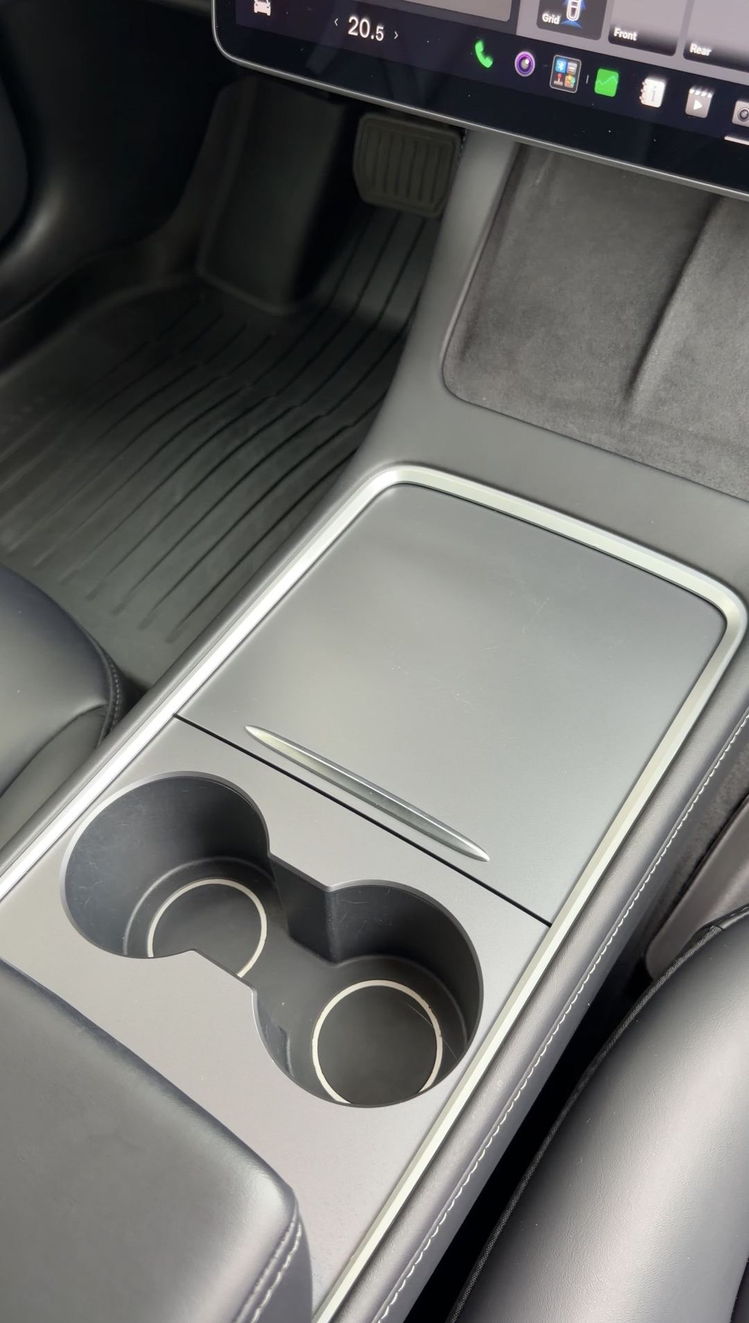 Tesla Model 3 center console after cleaning, clean cupholders and closed storage lid