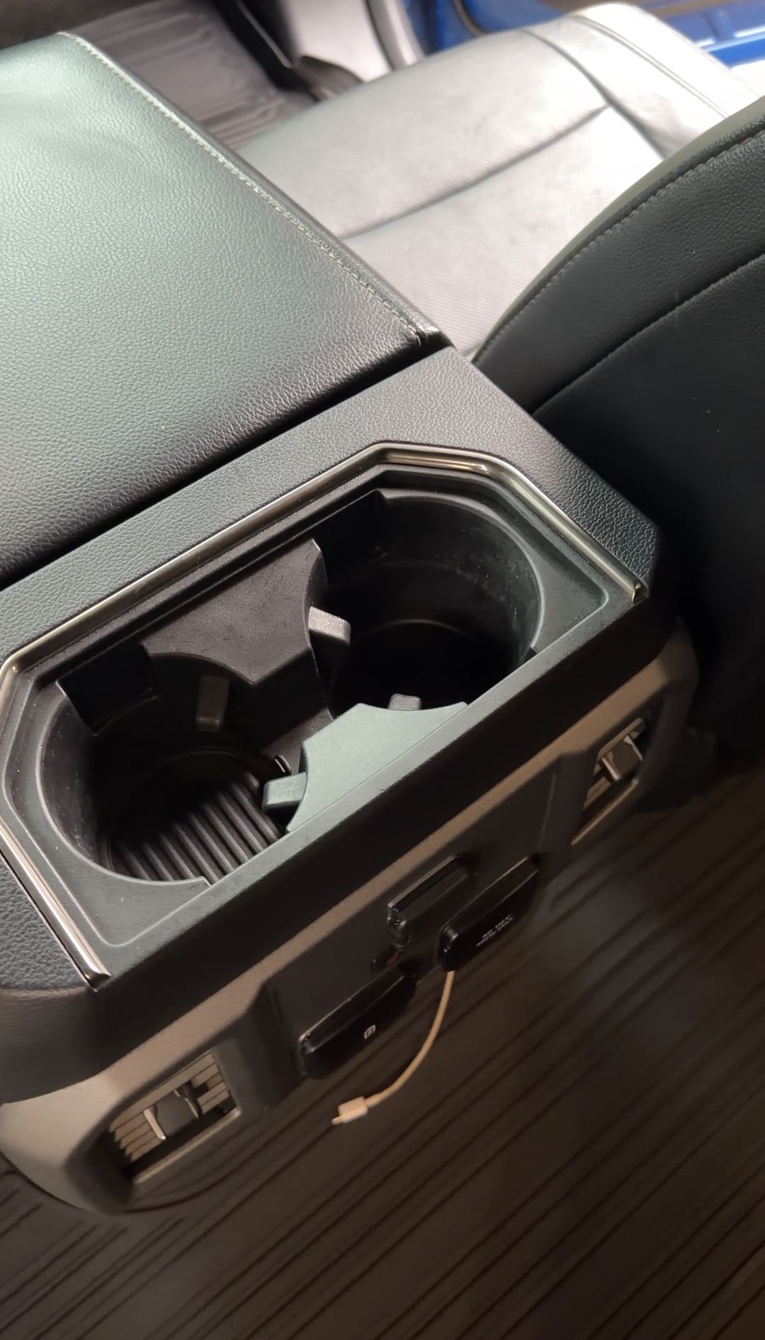 Clean rear cupholders of a Ford F-150 Raptor after an interior detail