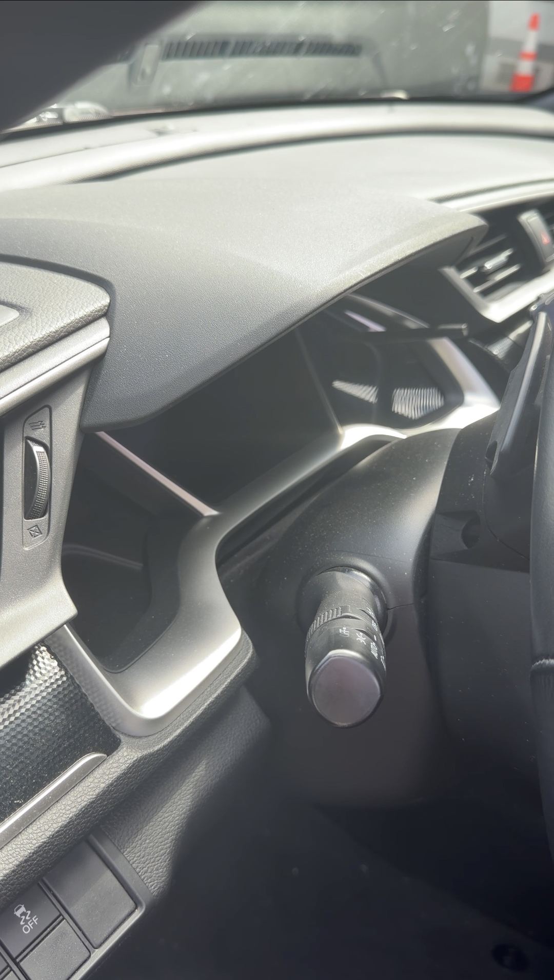 Dust on the dashboard and vent of a Honda Civic before the detail