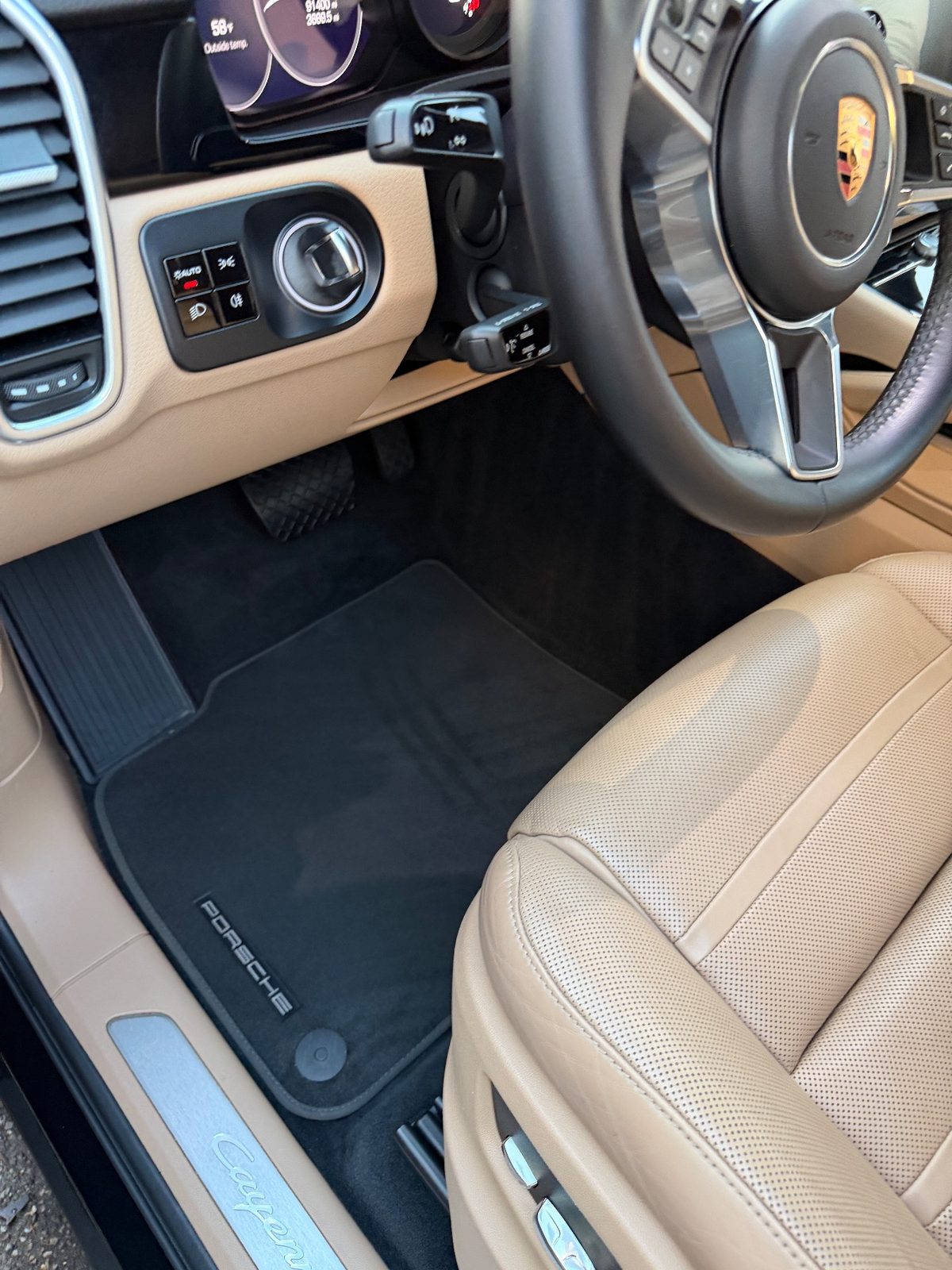 Driver footwell of a dark blue Porsche Cayenne in the Marina, San Francisco, after detailing
