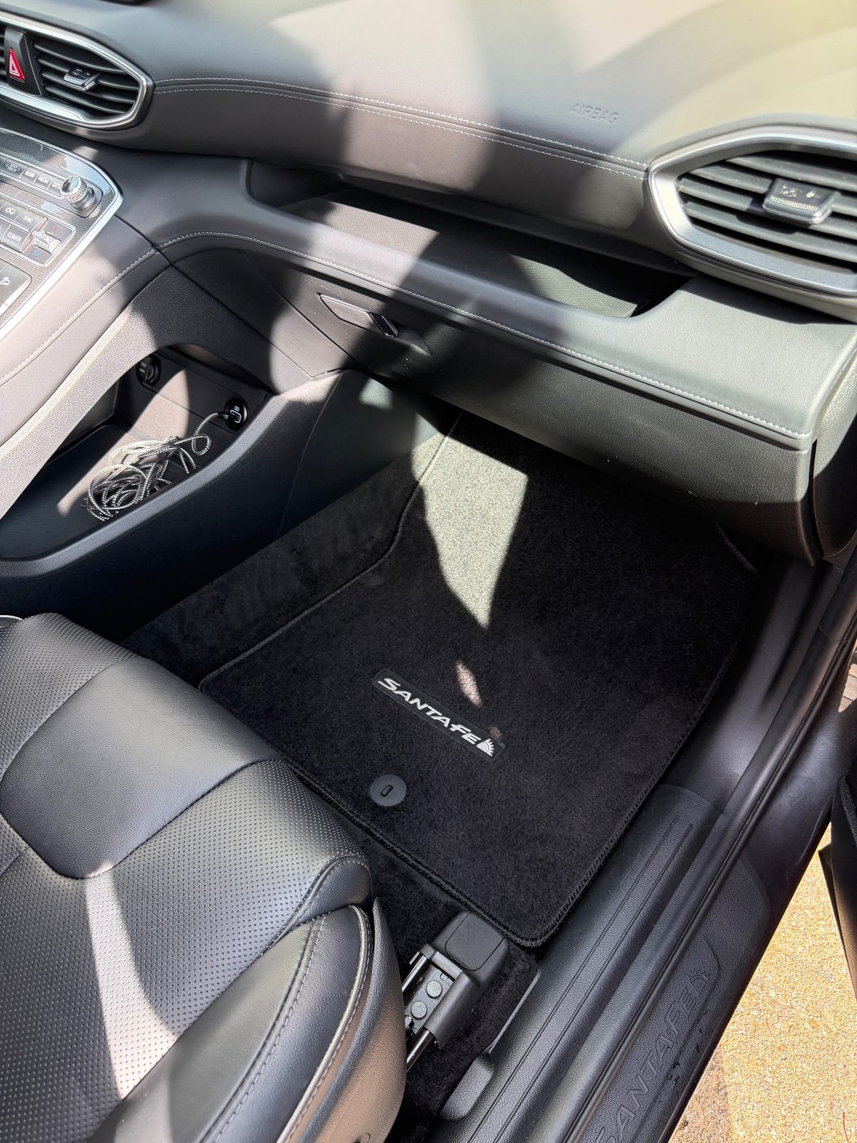 Vacuumed front passenger footwell mat of a Hyundai Santa Fe after detailing