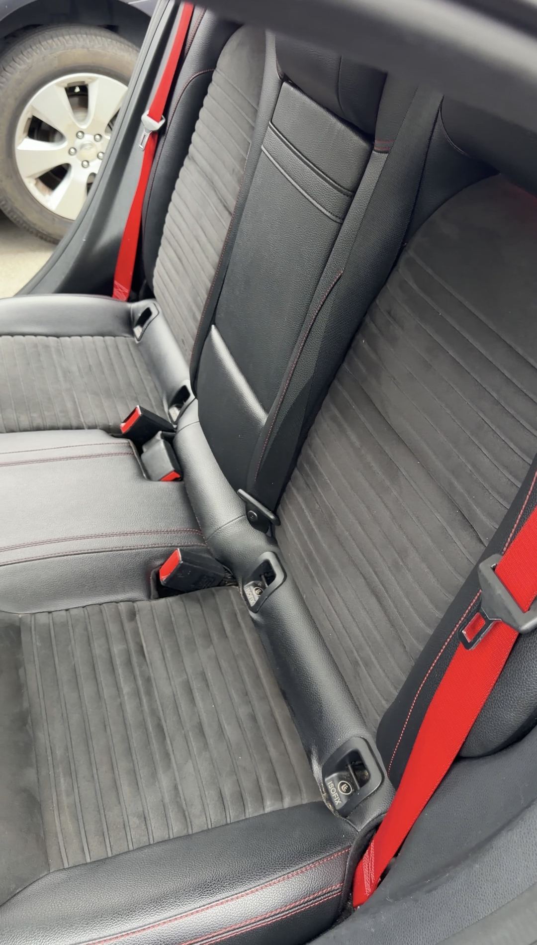 Rear bench of a Mercedes-Benz CLA250 with grey microfibre seats before interior detailing