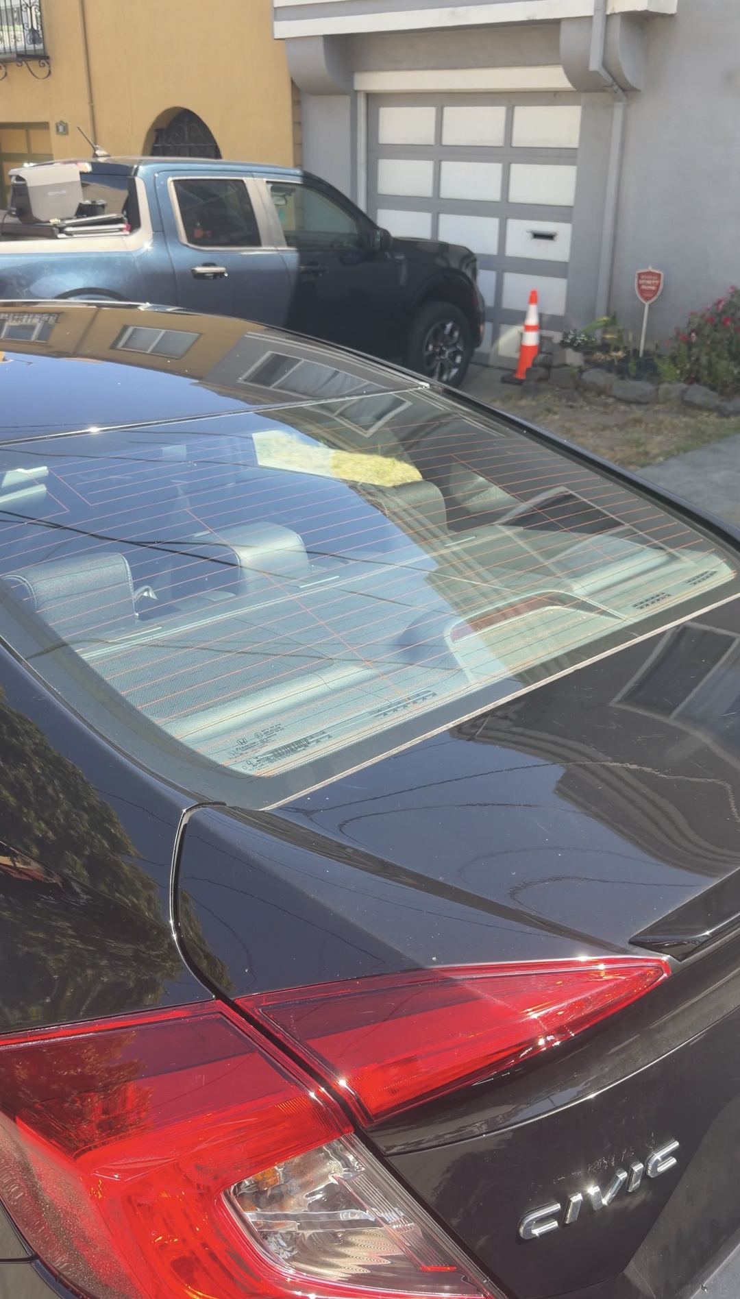 Spotless rear glass and trunk lid on a Honda Civic after the exterior detail