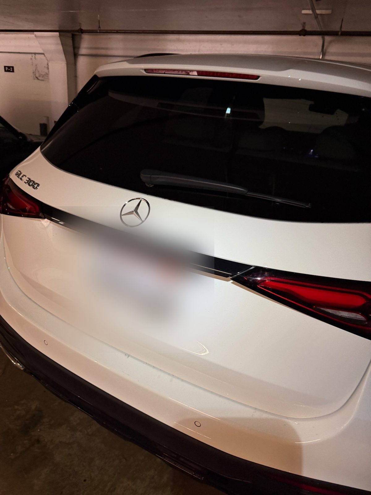 Rear tailgate of a white Mercedes-Benz GLC 300 after washing