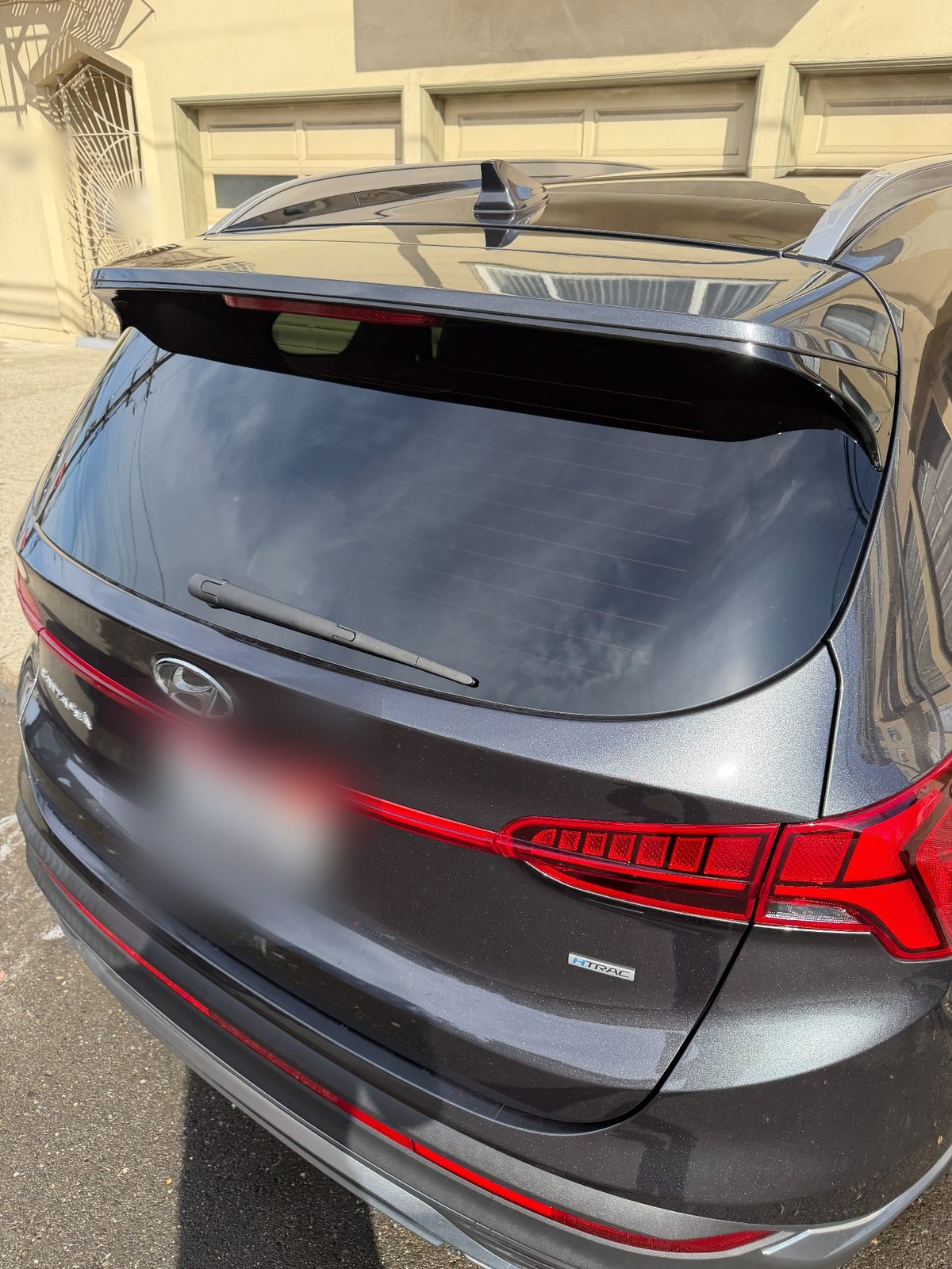 Rear of a dark grey Hyundai Santa Fe after detailing
