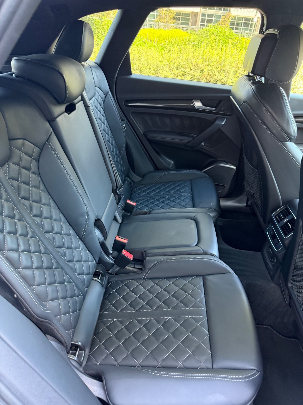 Clean quilted leather rear seat in an Audi SQ5 after detailing