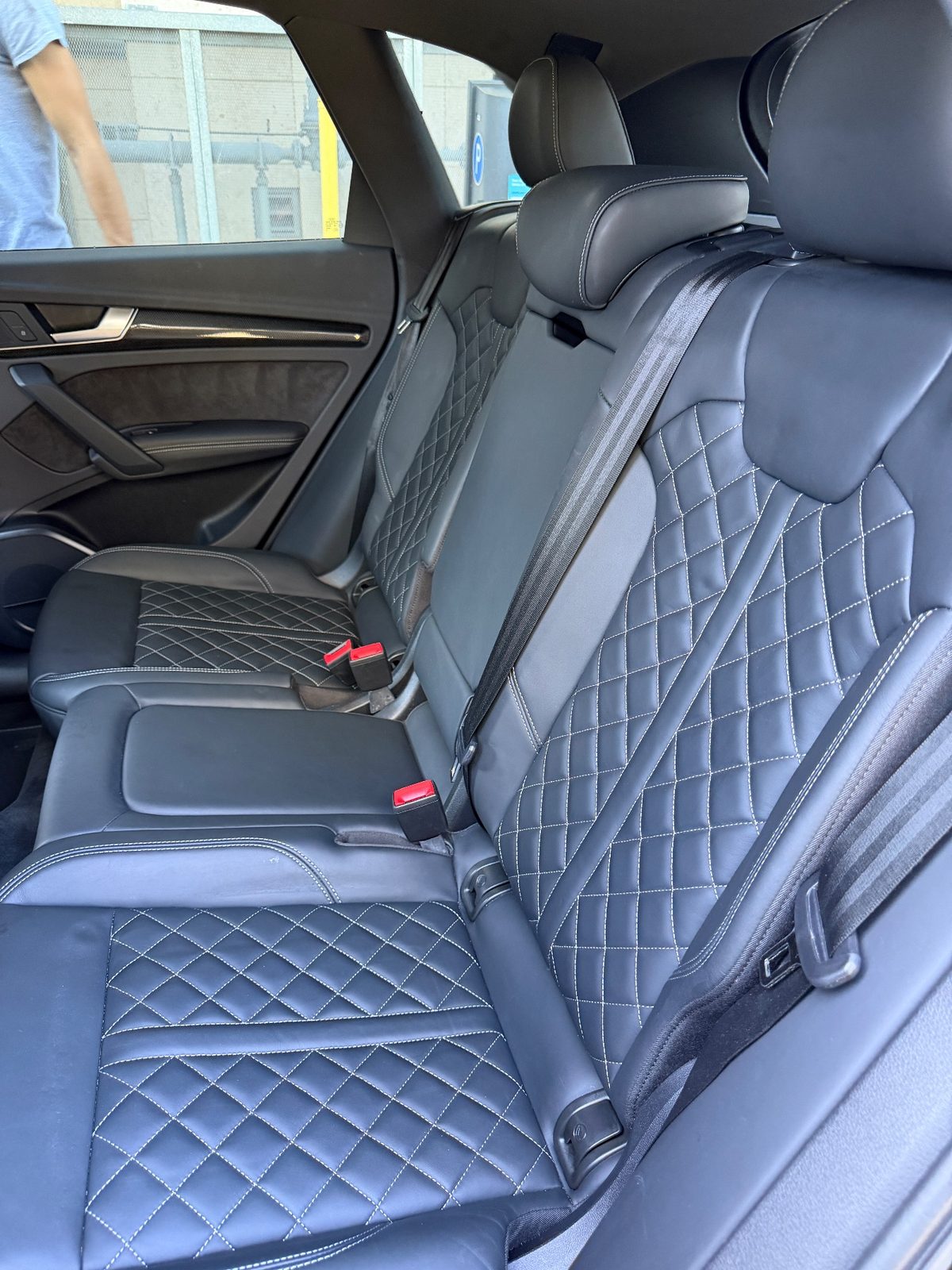 Clean quilted leather rear seat in an Audi SQ5 after detailing