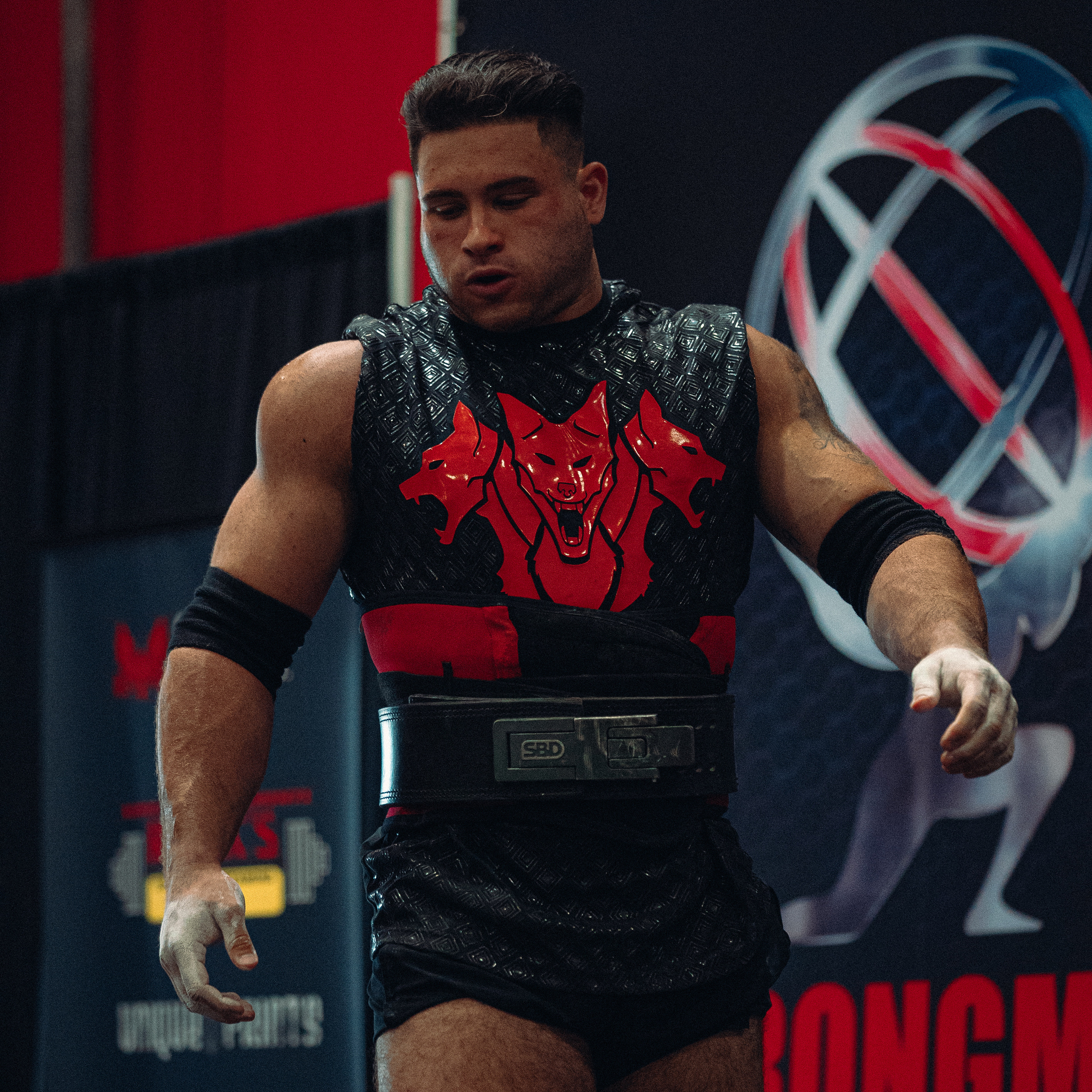 Johnny, founder of Align Strength Training, preparing to compete in strongman
