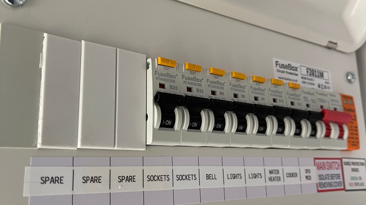 Consumer unit with individually labeled circuit breakers — certified electrician installation Consumer unit with individually labeled circuit breakers — certified electrician installation