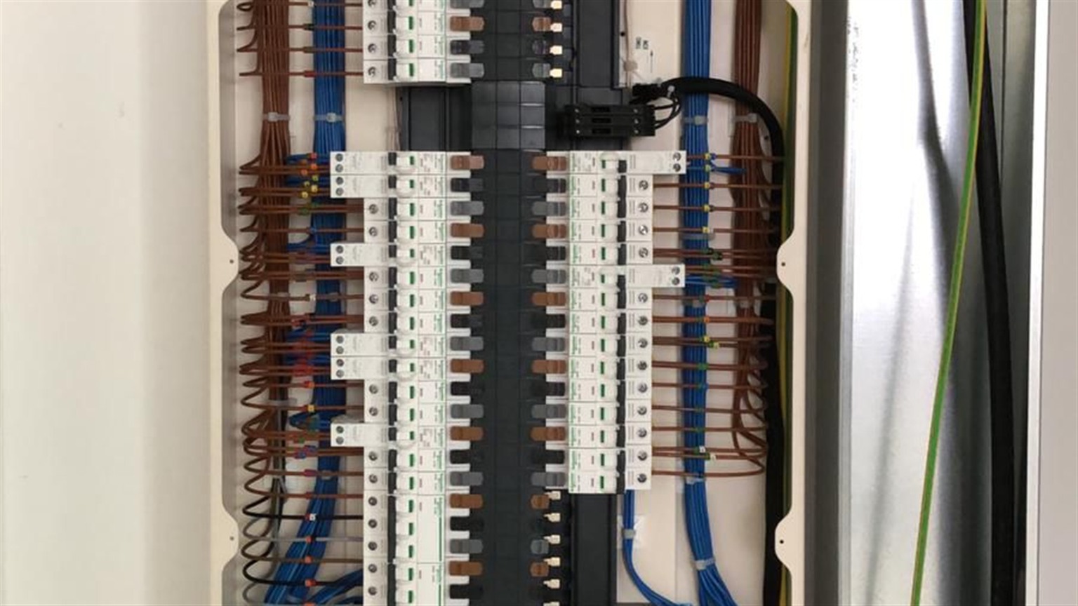 Large commercial distribution board with multi-circuit MCBs and professional cable management Large commercial distribution board with multi-circuit MCBs and professional cable management
