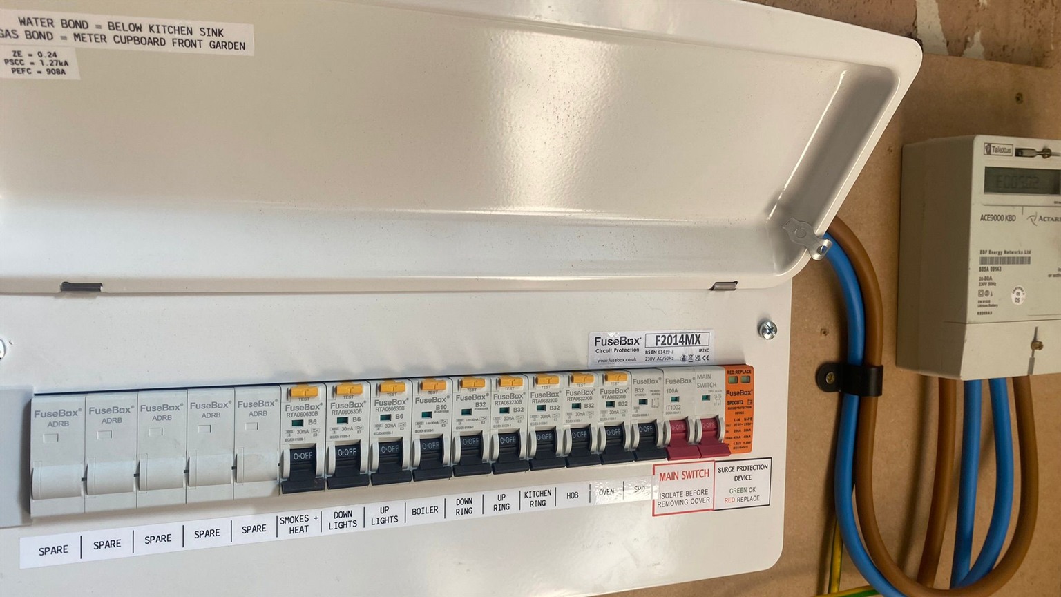 FuseBox consumer unit with labeled circuits and surge protection device indicator — EICR compliant installation