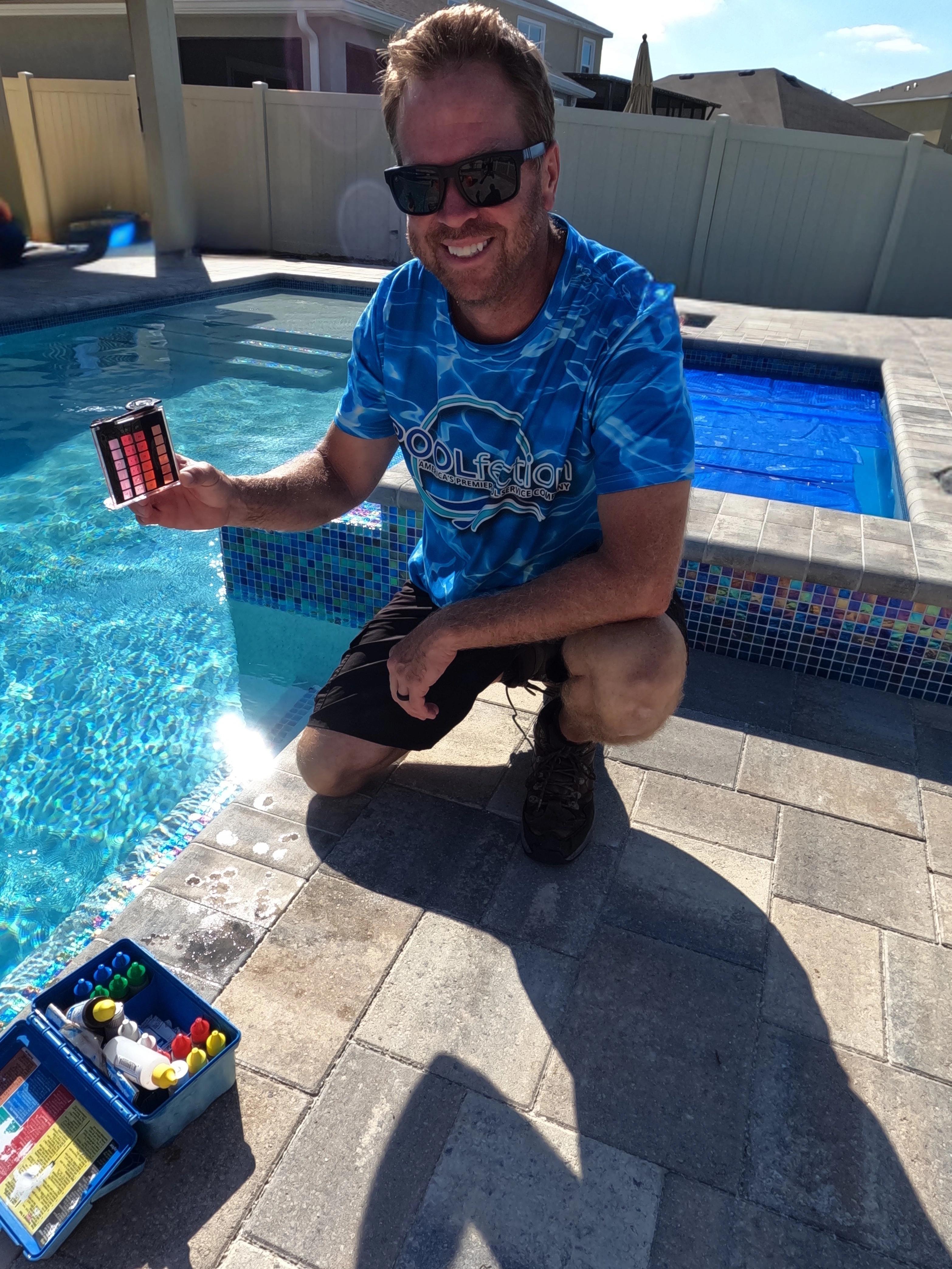 POOLfection technician servicing a swimming pool