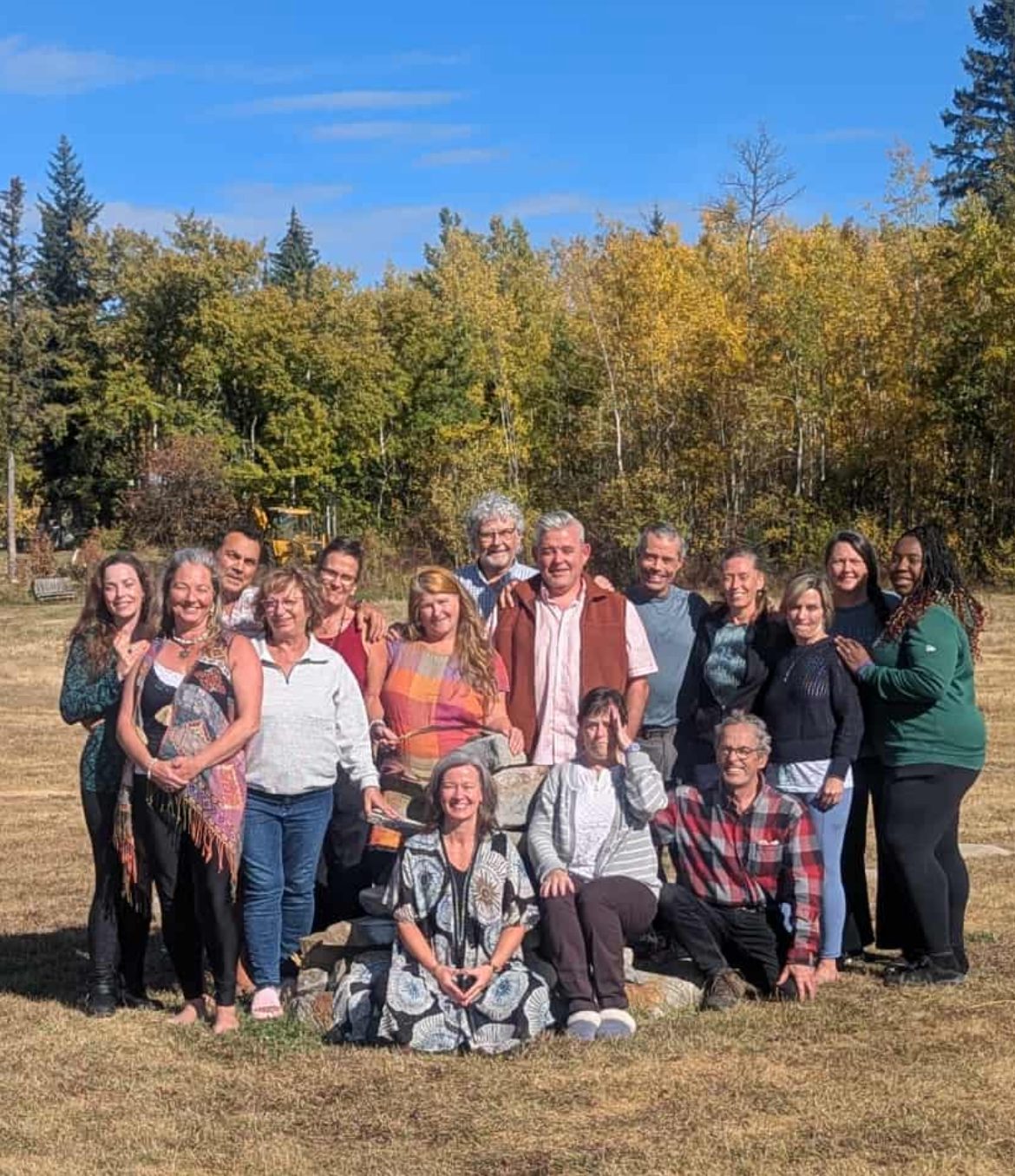 Orest with a group of participants outdoors in autumn